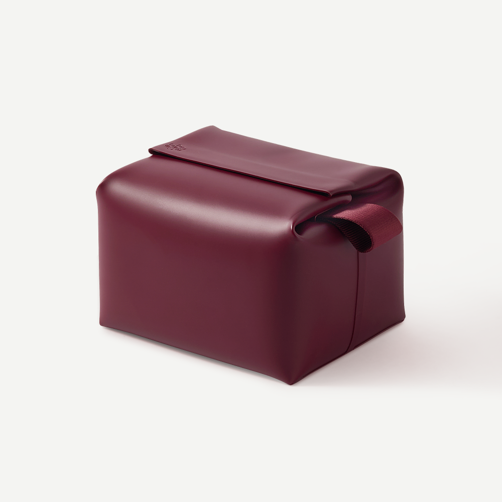 Maroon leather pouch on a white background
