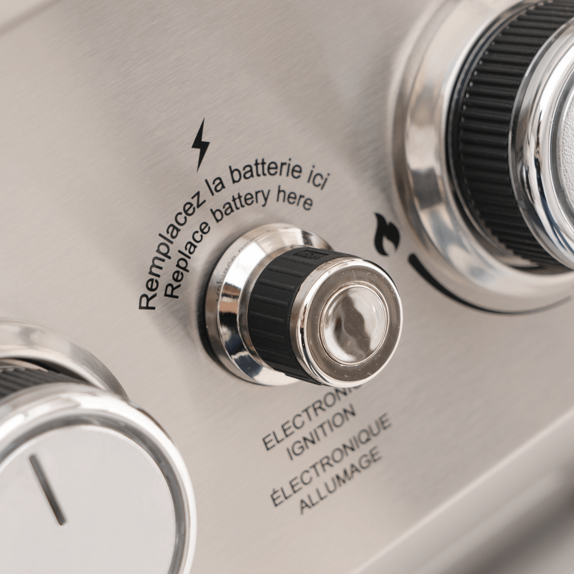 Close-up of an electronic device with battery replacement instructions.