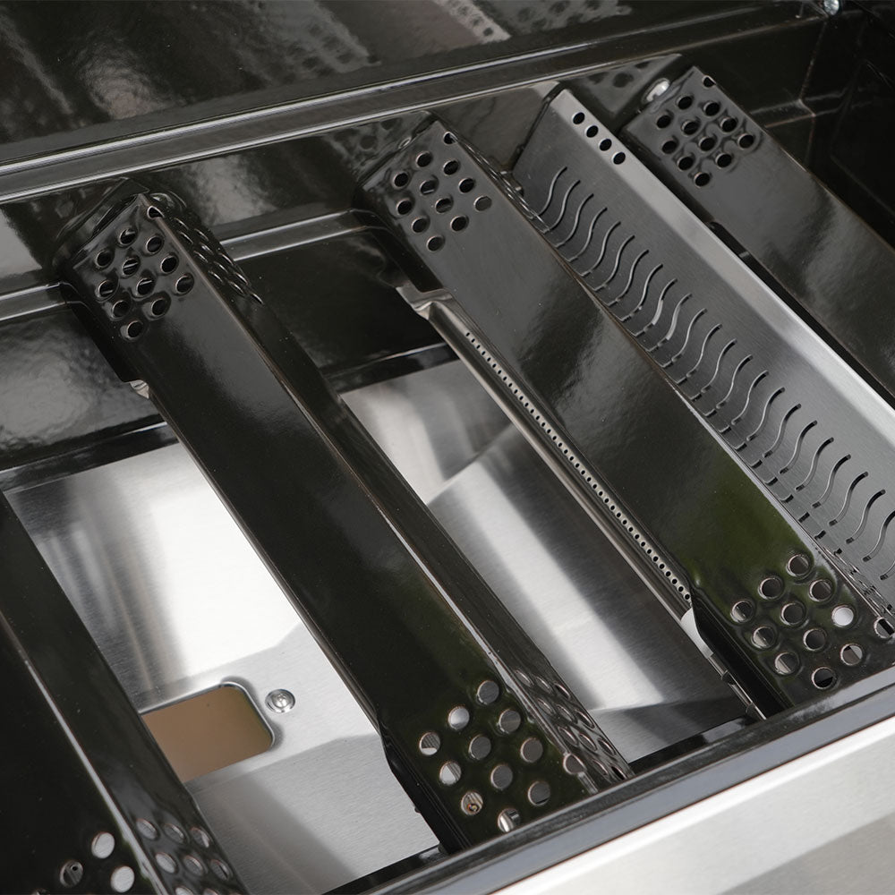 Close-up of a metallic kitchen appliance with various components.