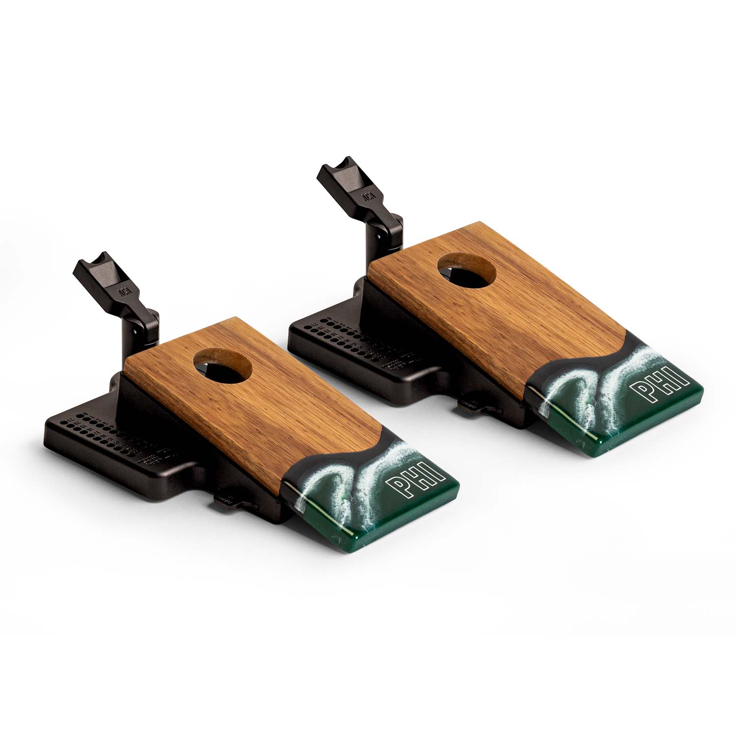 Two wooden guitar bridge saddles with black hardware on a white background