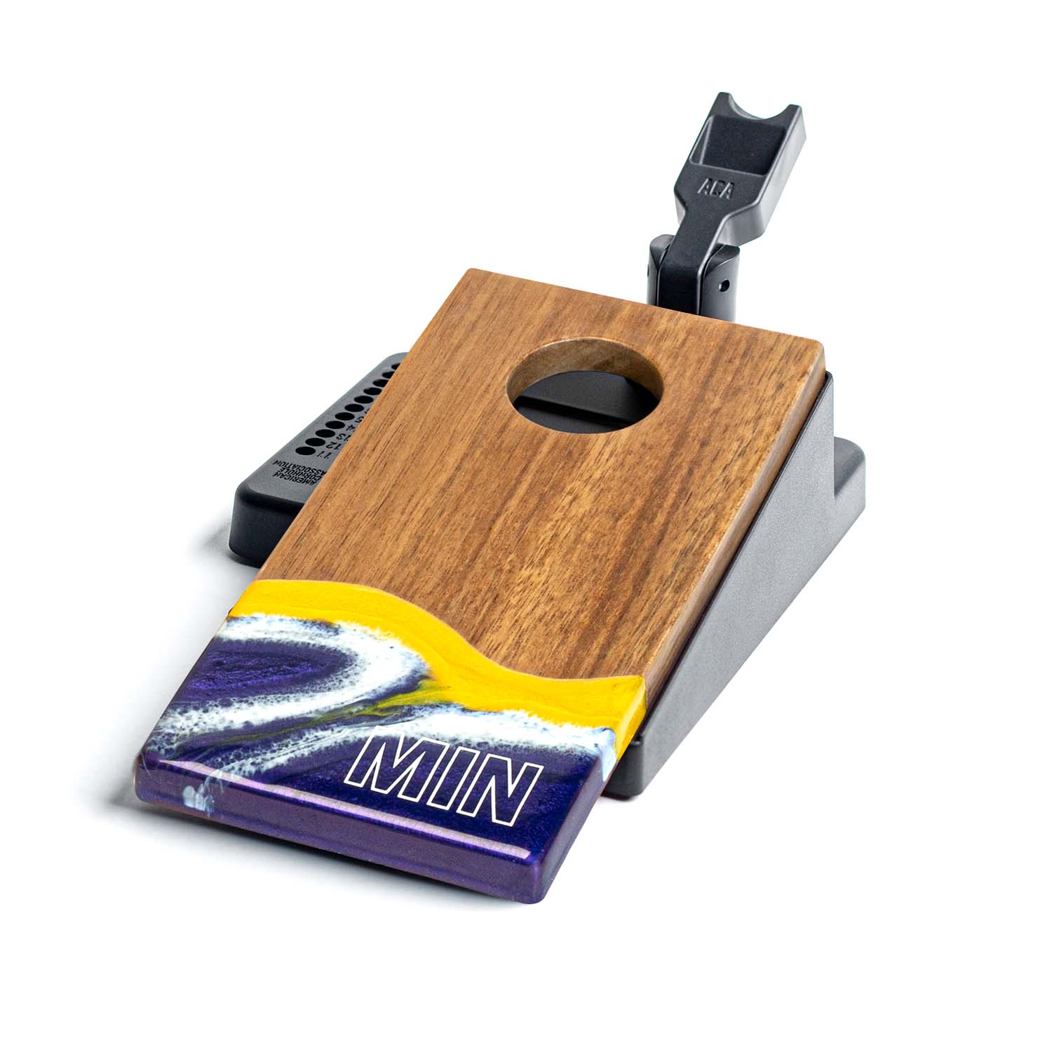 Wooden and metal device with a 'MIN' label on a white background