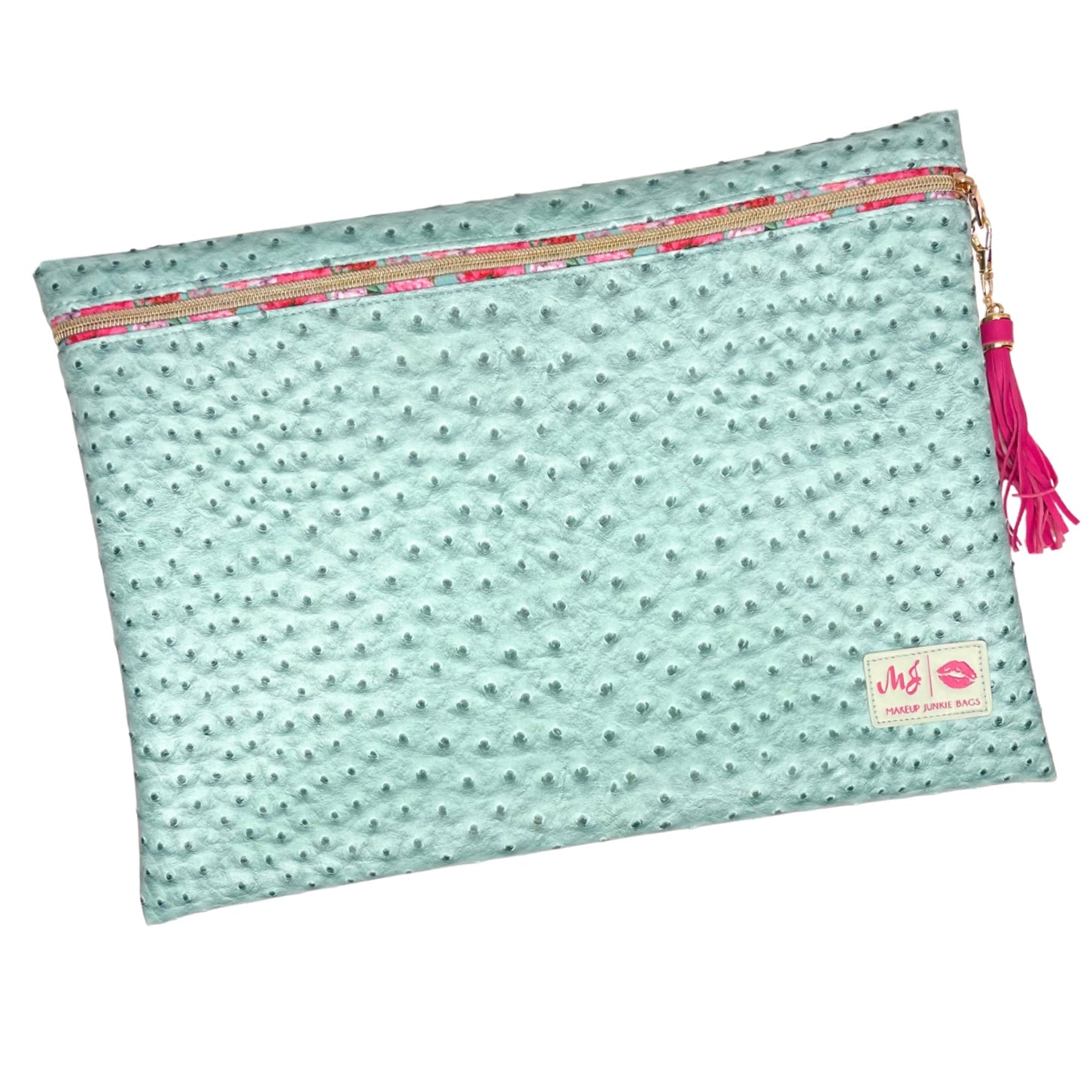 Light blue pouch with pink tassel and pattern on a white background
