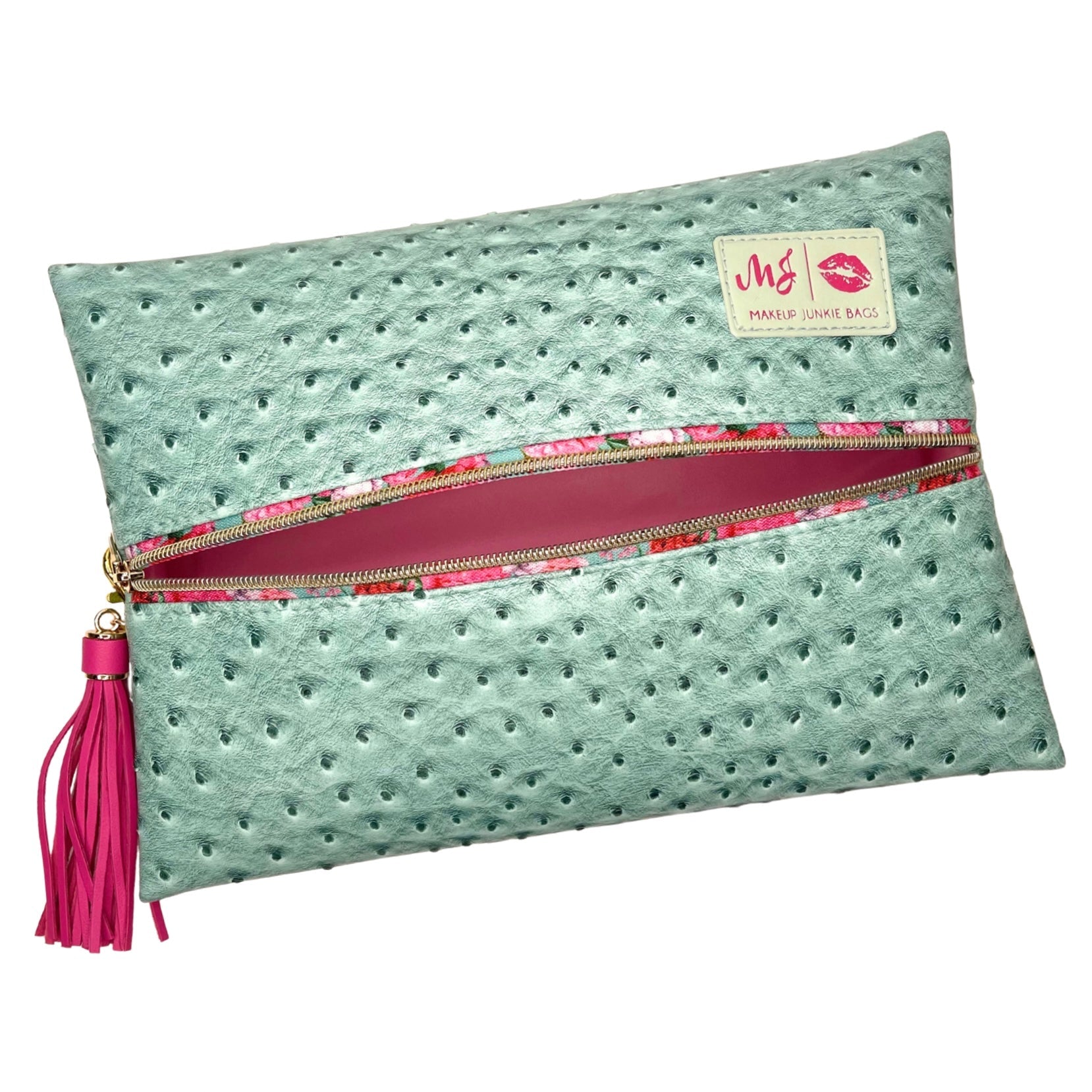Mint green clutch bag with pink zipper and tassel on a white background