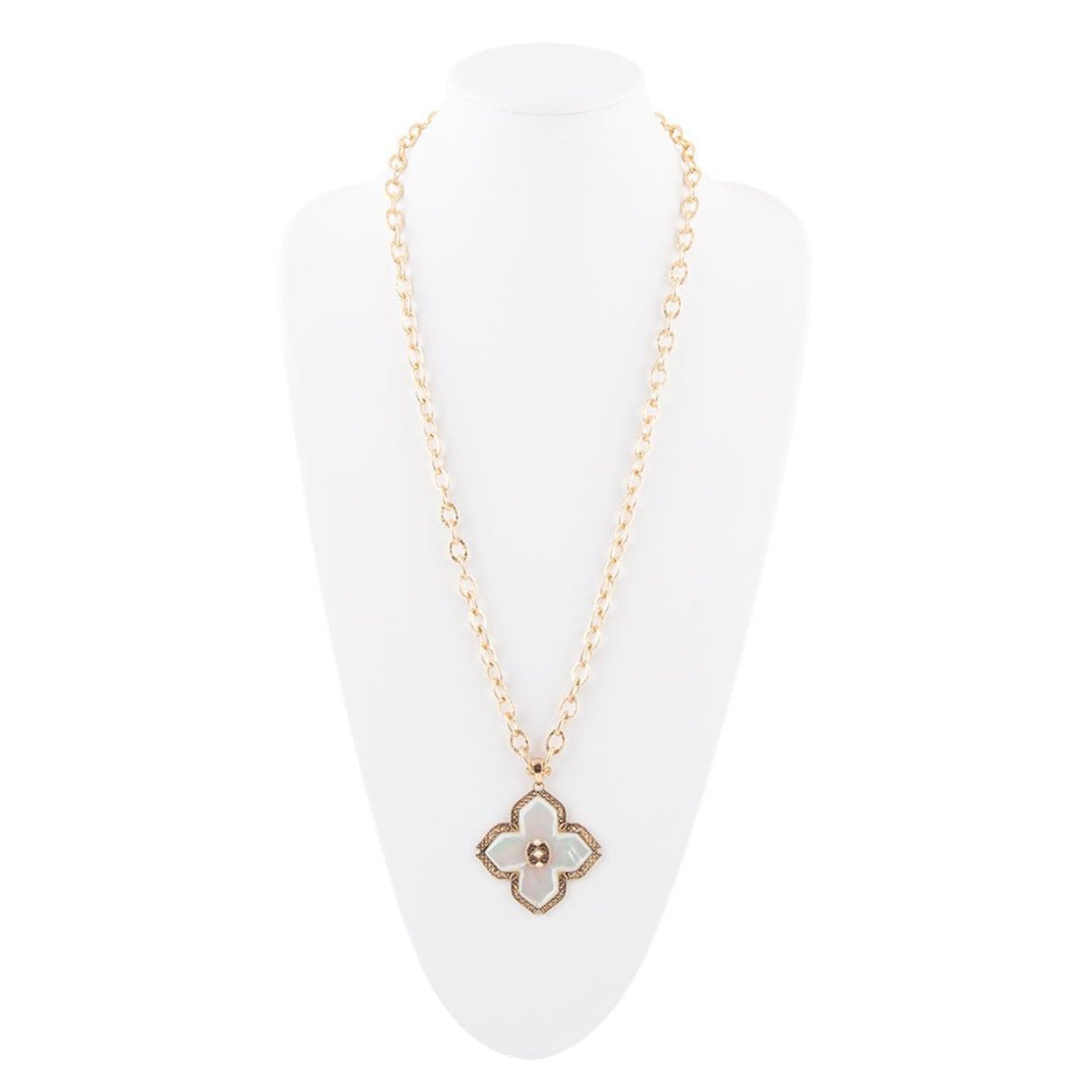 Necklace with a clover-shaped pendant on a white stand