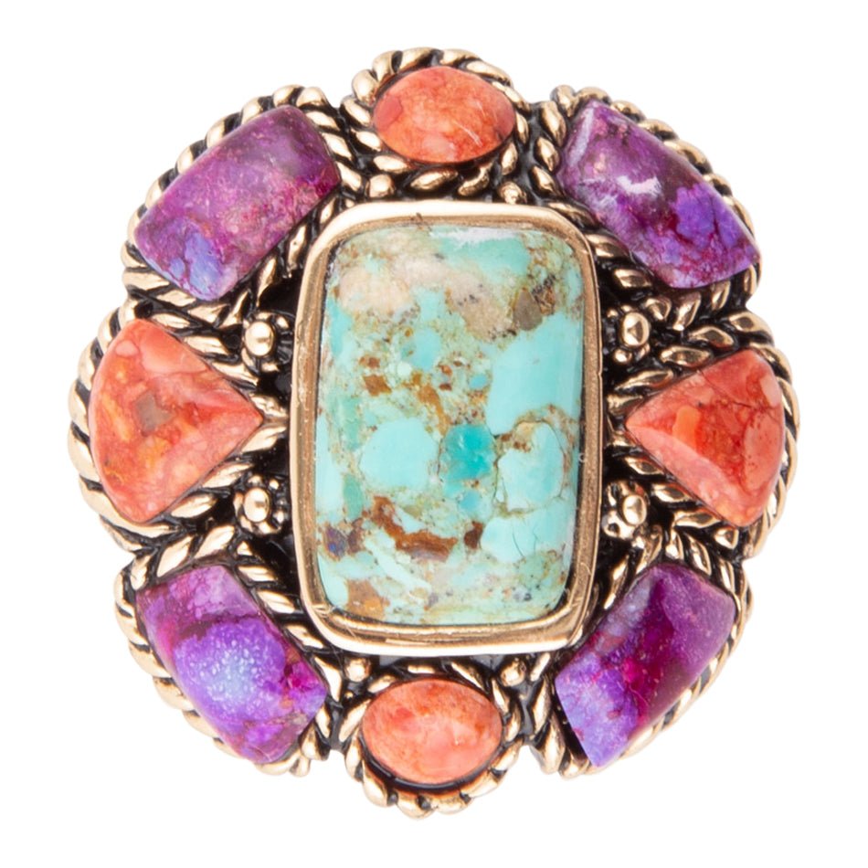 Ring with colorful gemstones on a white background