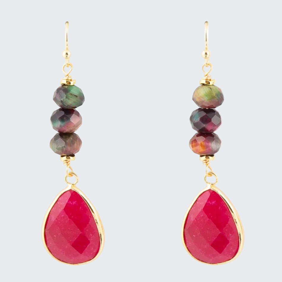 Jewelry set with multicolored beaded earrings and pink teardrop pendants on a white background