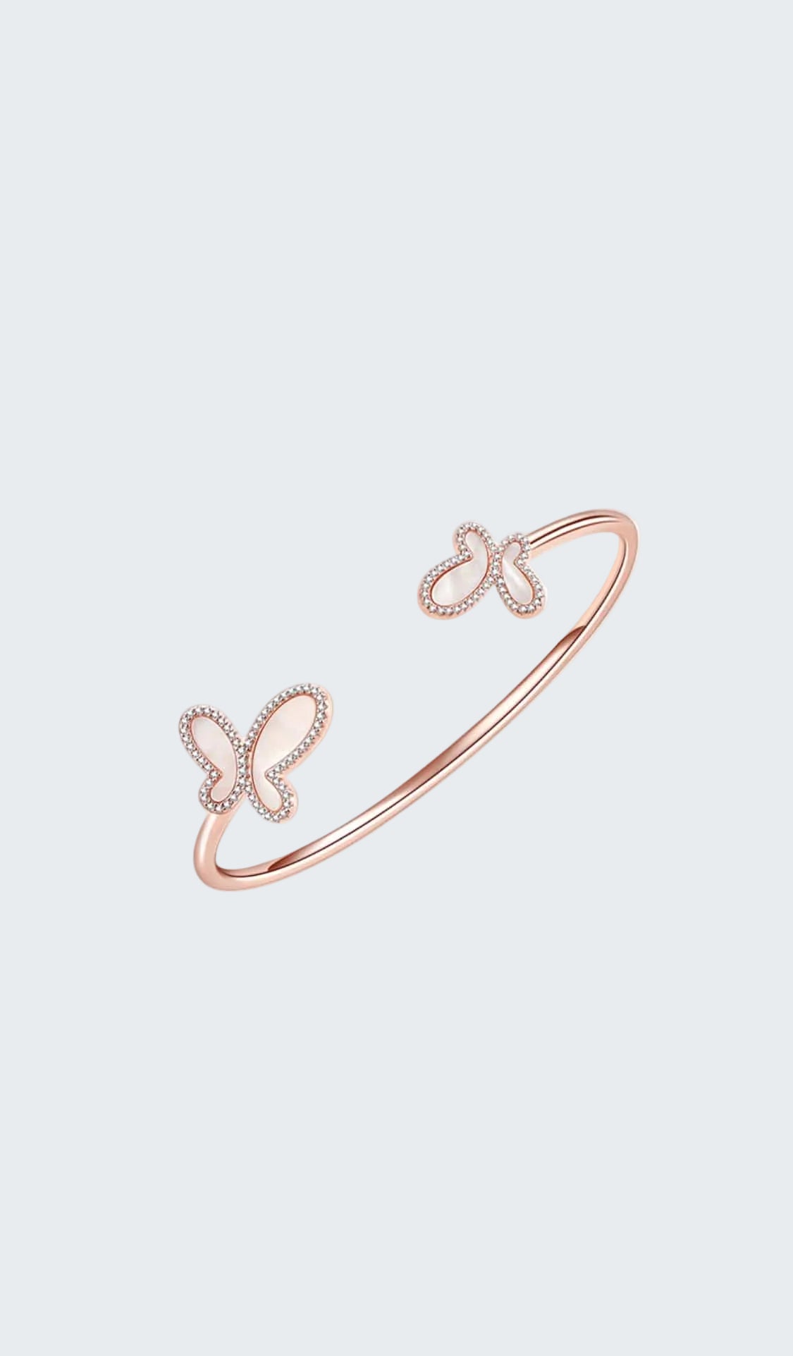 Rose gold bracelet with butterfly designs on a white background