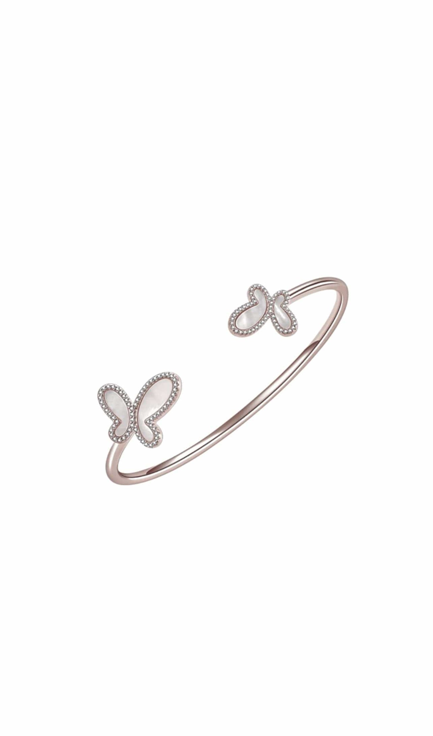 Rose gold bracelet with butterfly designs on a white background