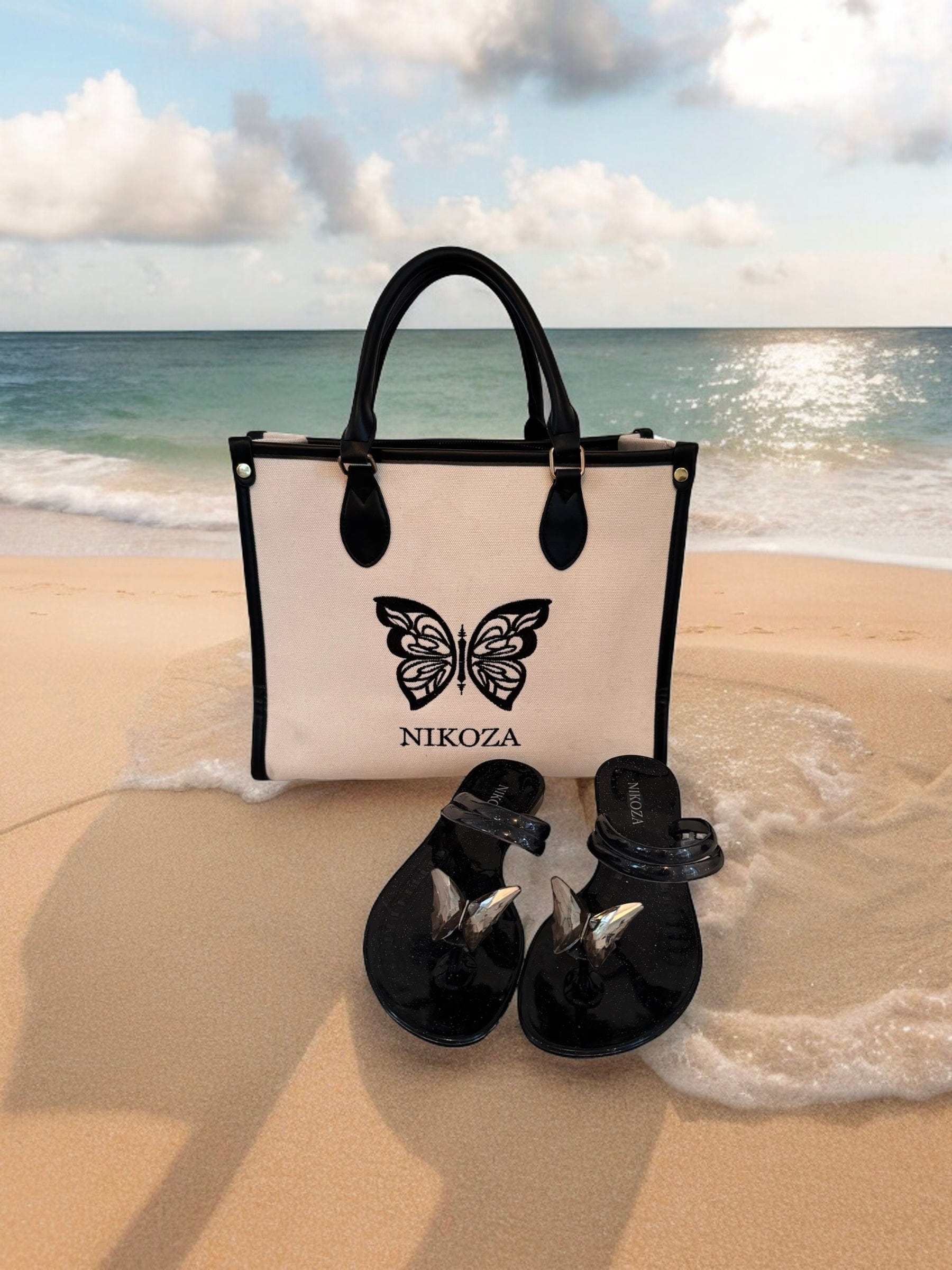 Nikoza bag and sandals on a beach with ocean view