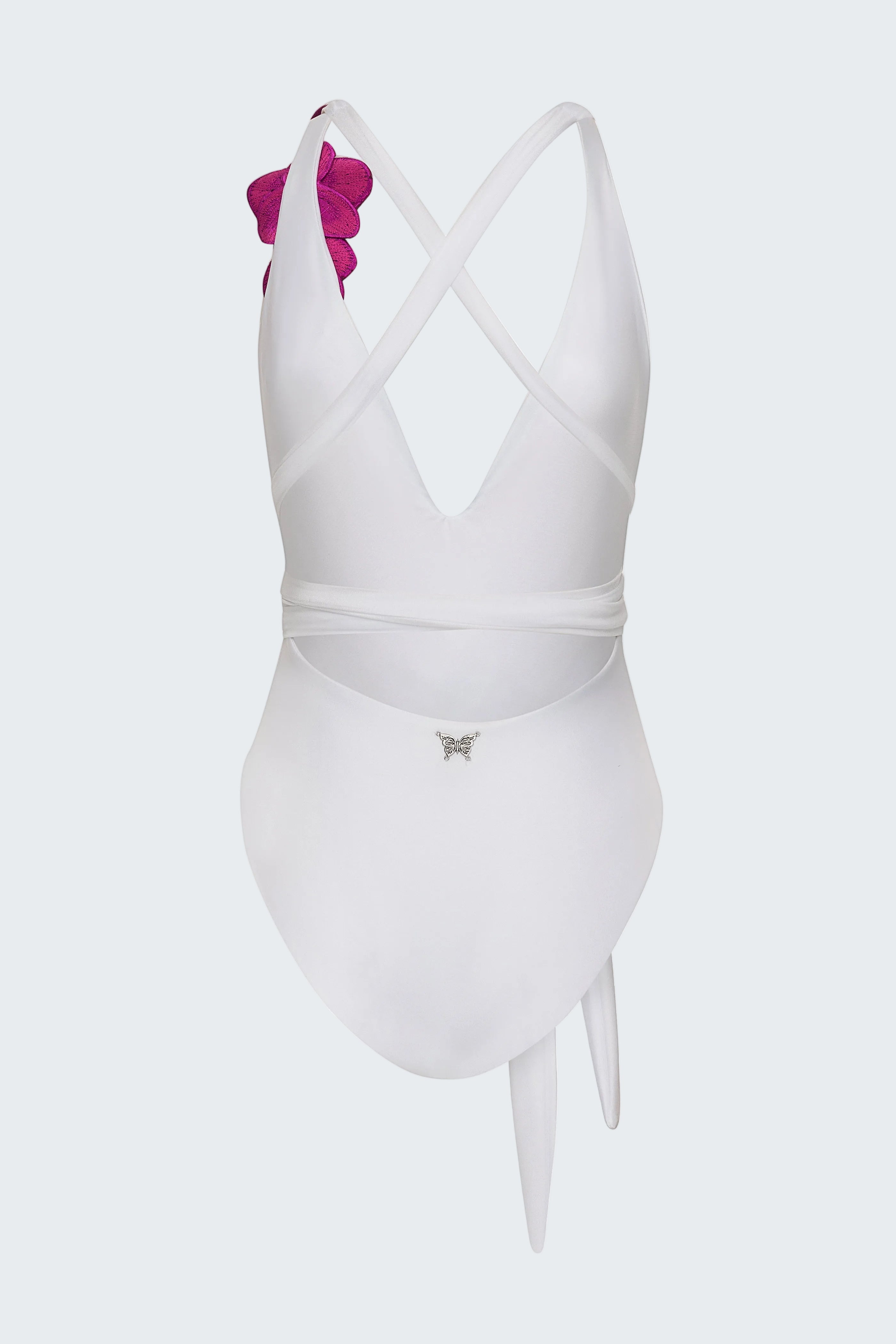 White swimsuit with pink bow on a white background