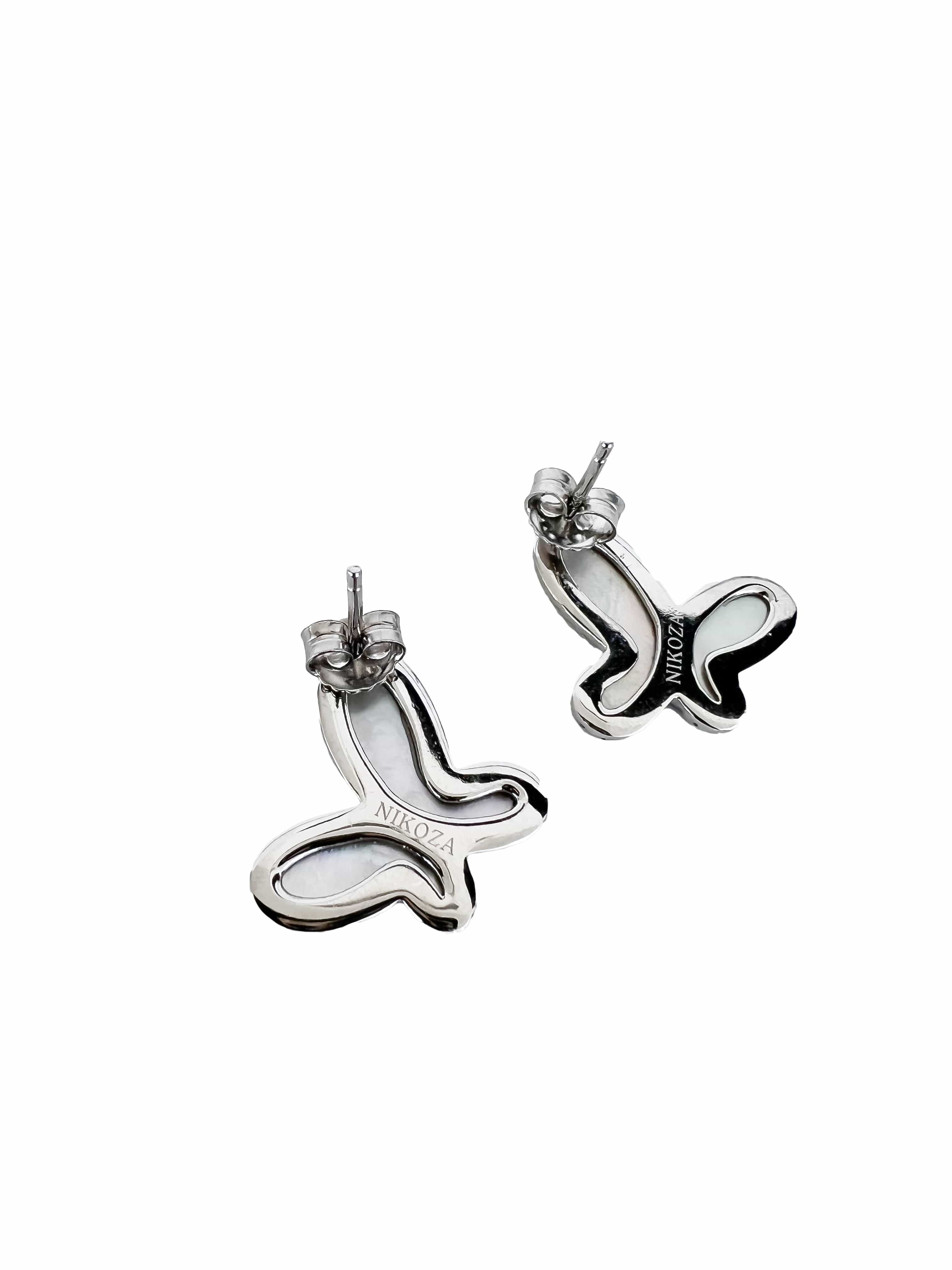 Pair of silver earrings with 'Miu Miu' logo on a white background