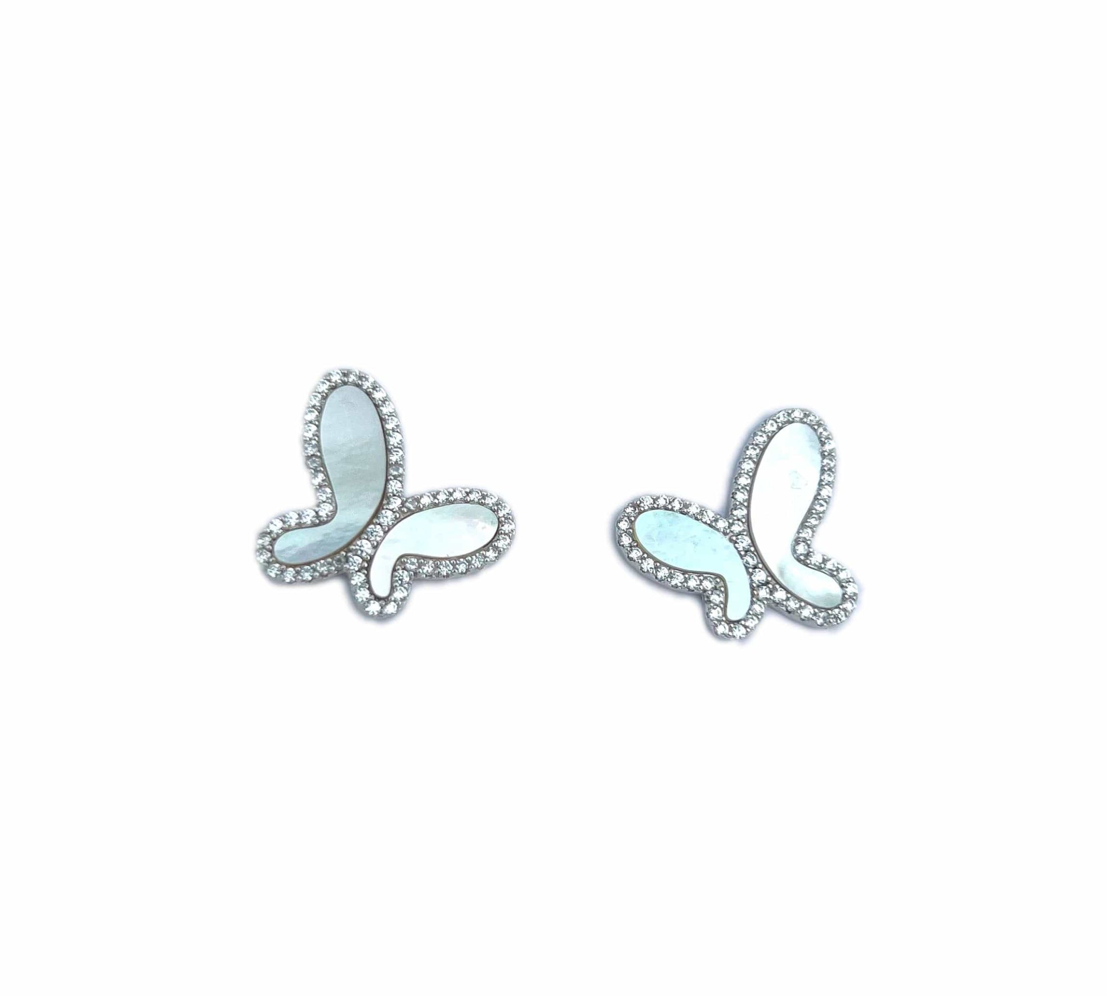 Pair of diamond stud earrings on a white background