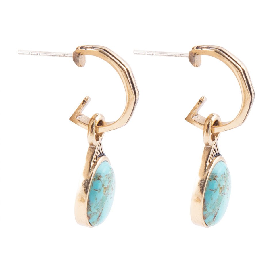 Gold hoop earrings with turquoise stones on a white background