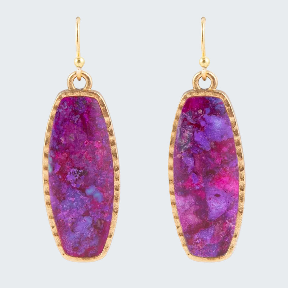 Purple stone earrings with gold frames on a white background