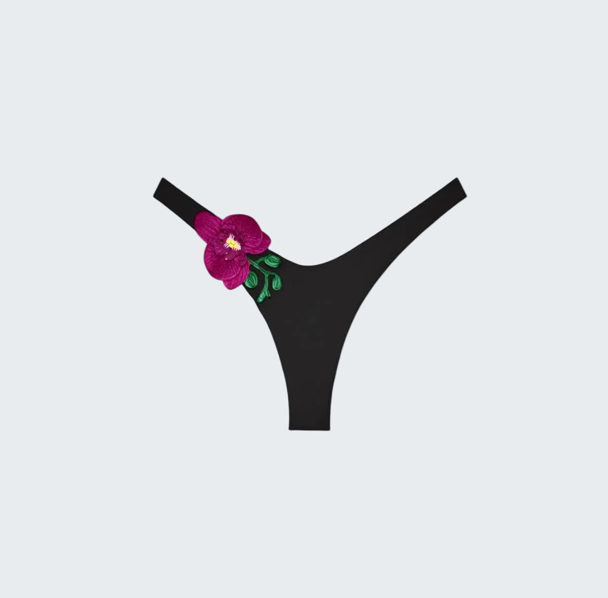 Black thong with a floral design on a white background