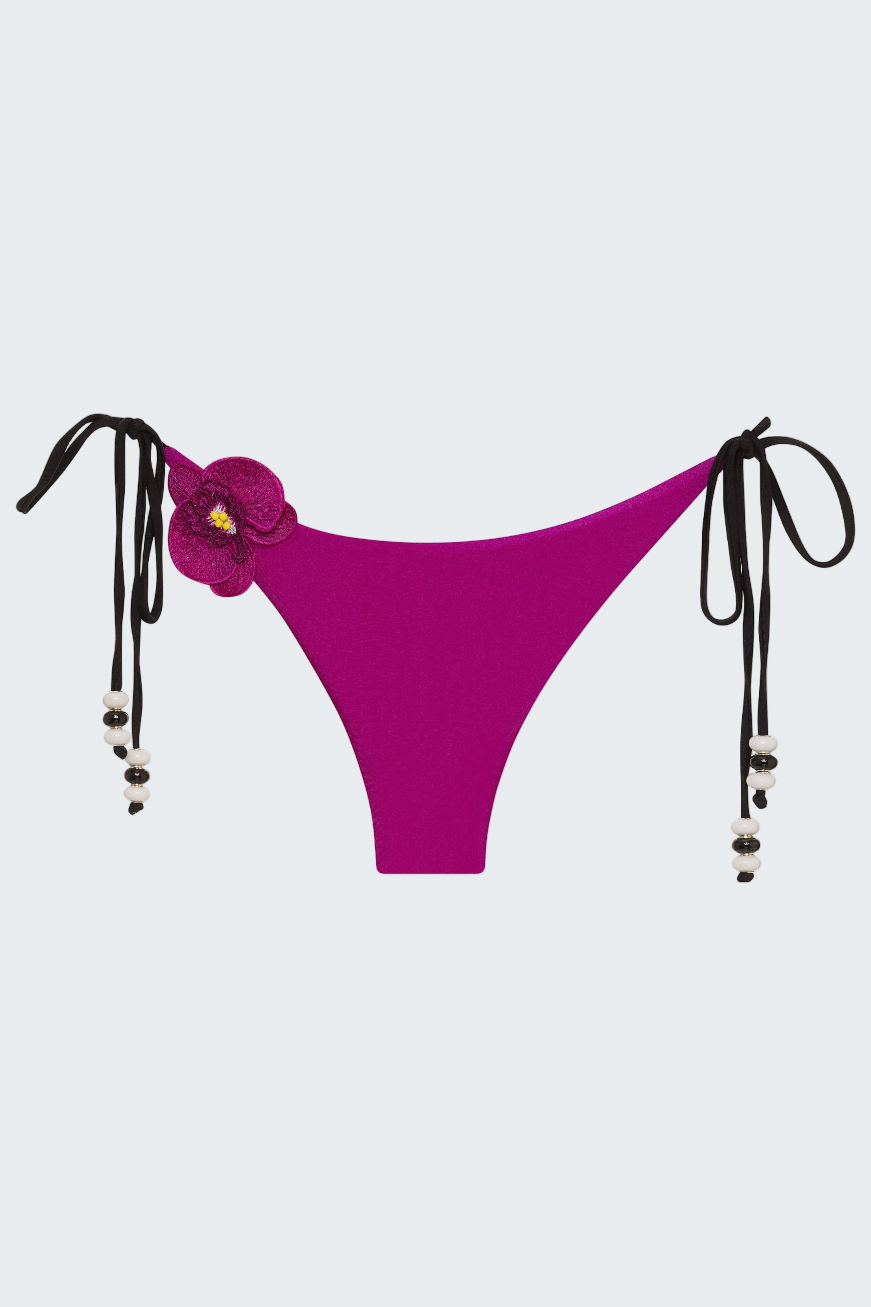 Purple bikini bottom with floral design and black straps on a white background
