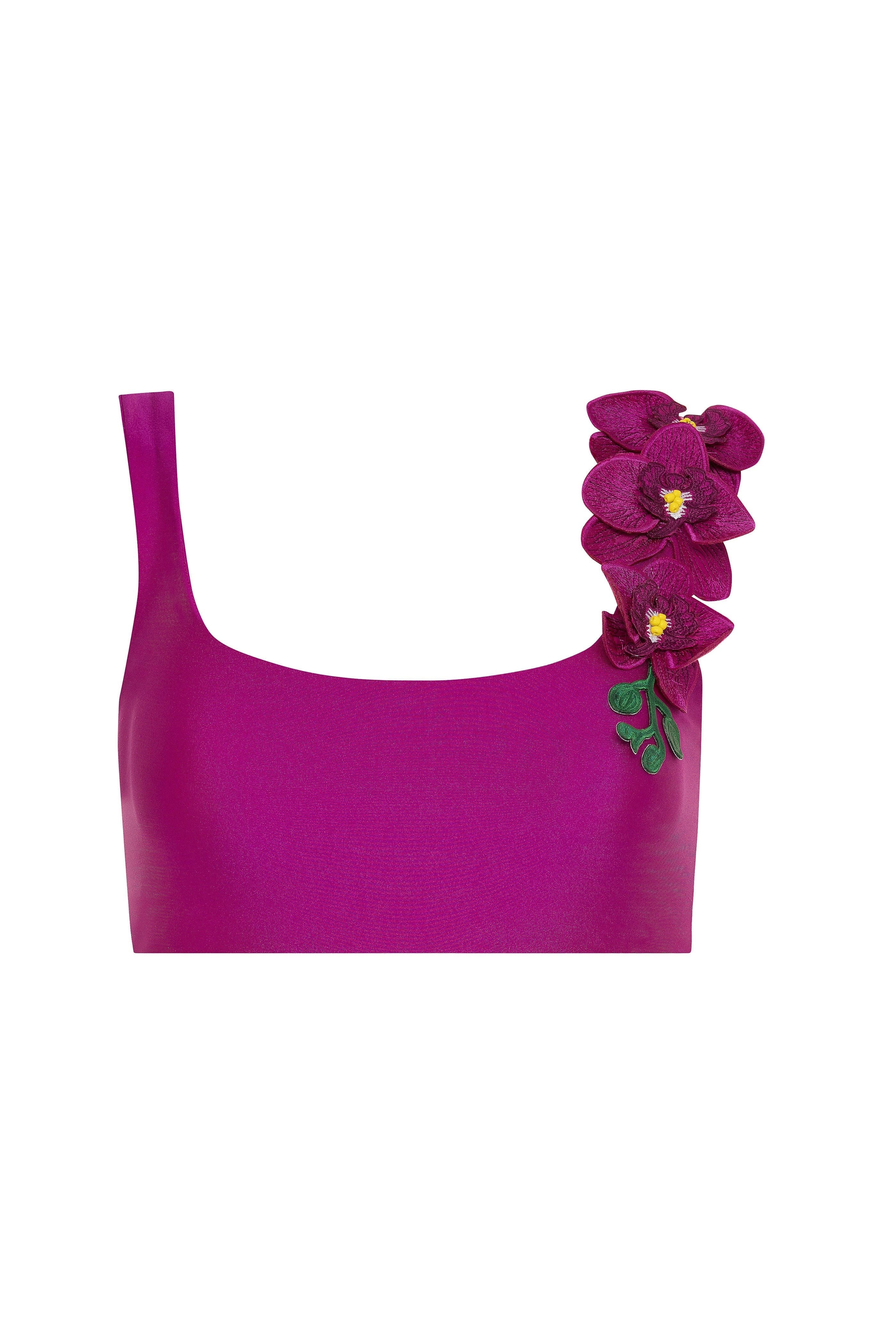 Purple top with a floral decoration on a white background
