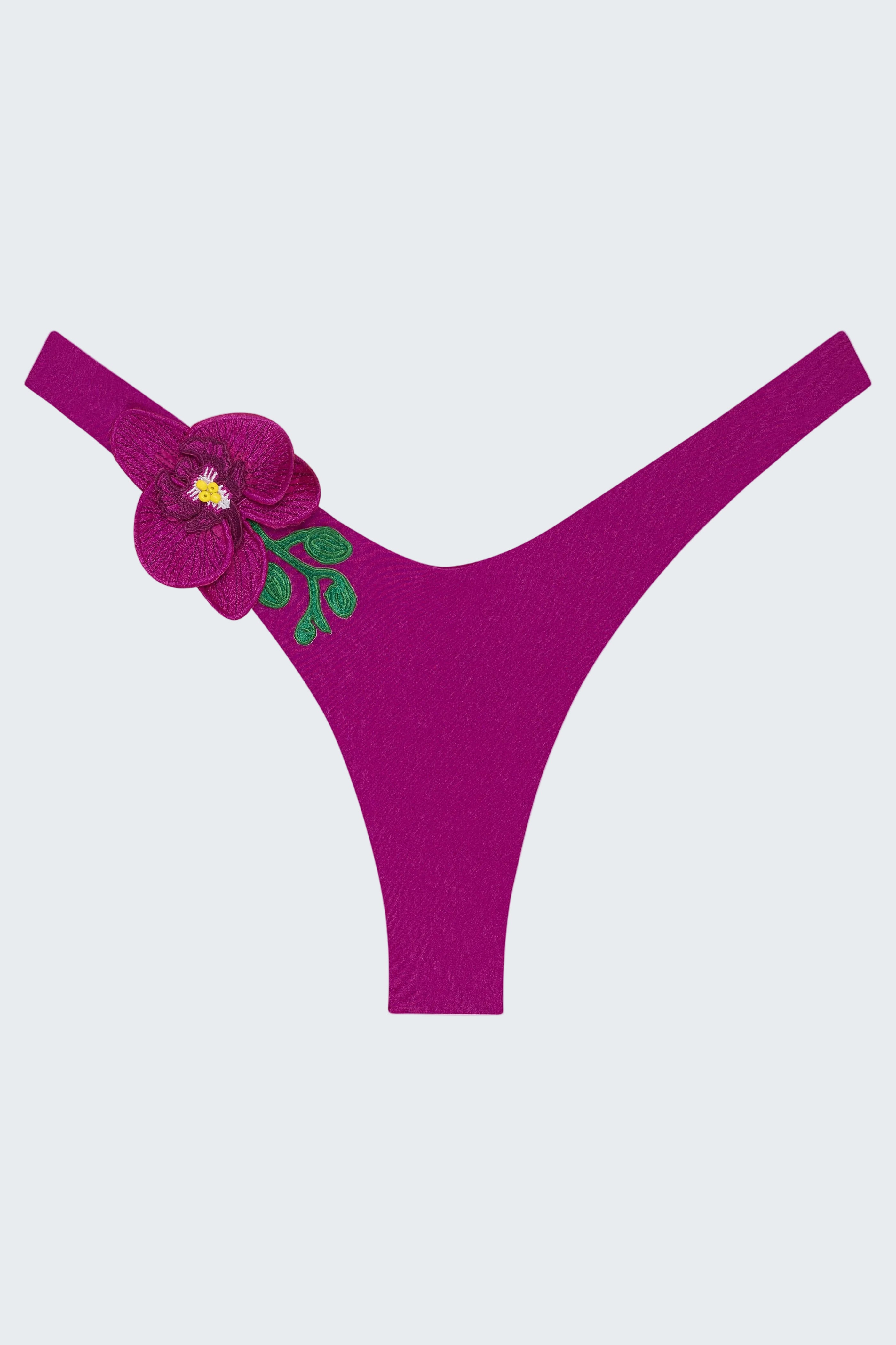 Purple thong with floral design on a white background