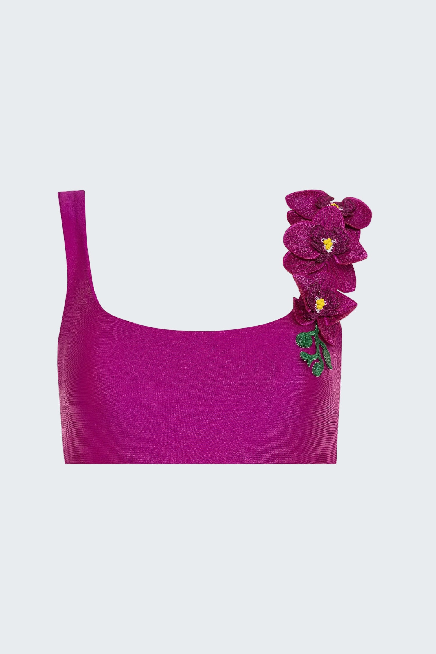Purple top with a floral decoration on a white background