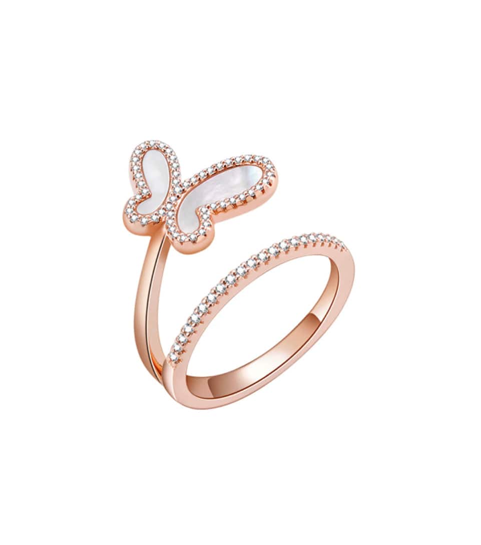 Rose gold butterfly ring with white gemstone on a white background