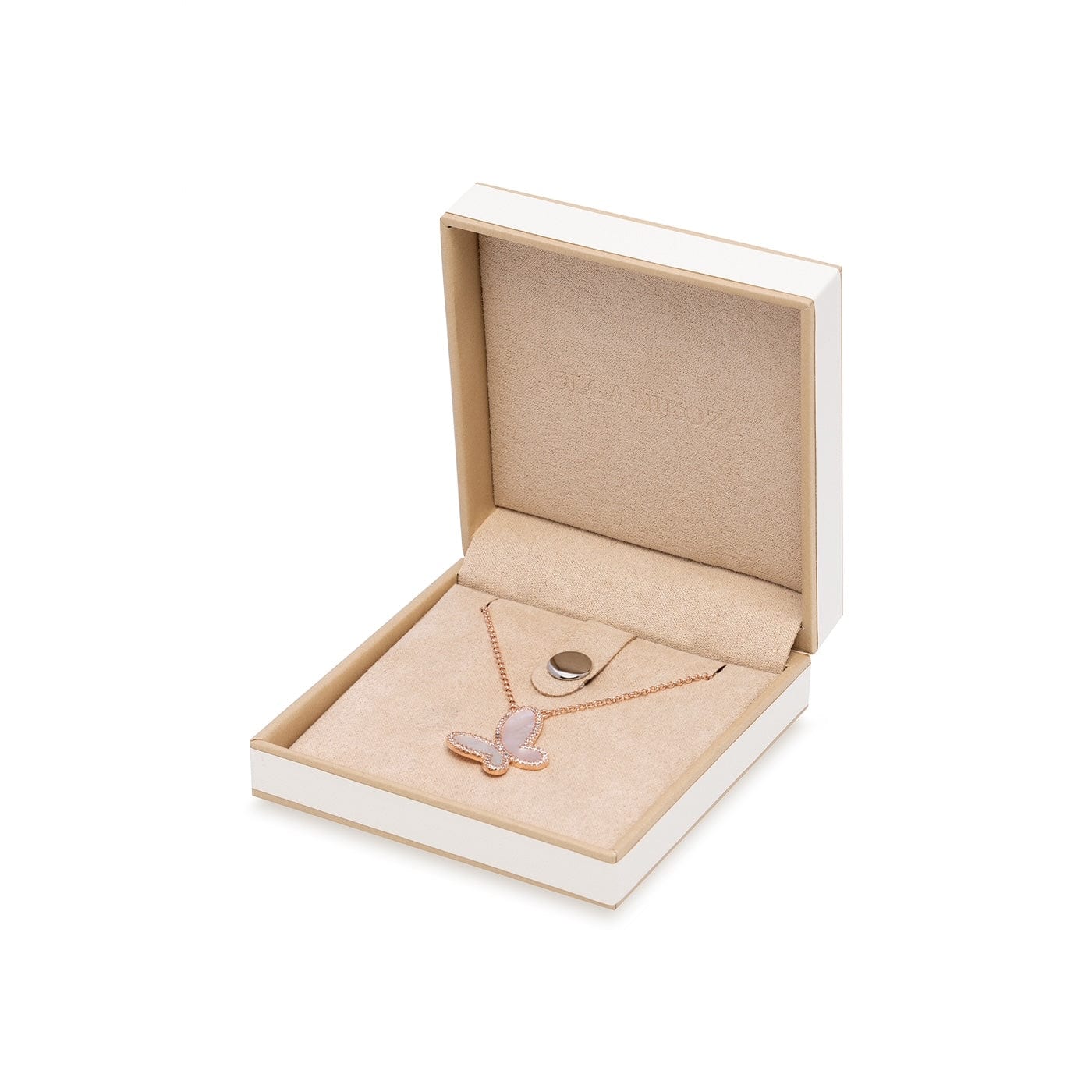 Necklace with a pink pendant in an open jewelry box on a white background