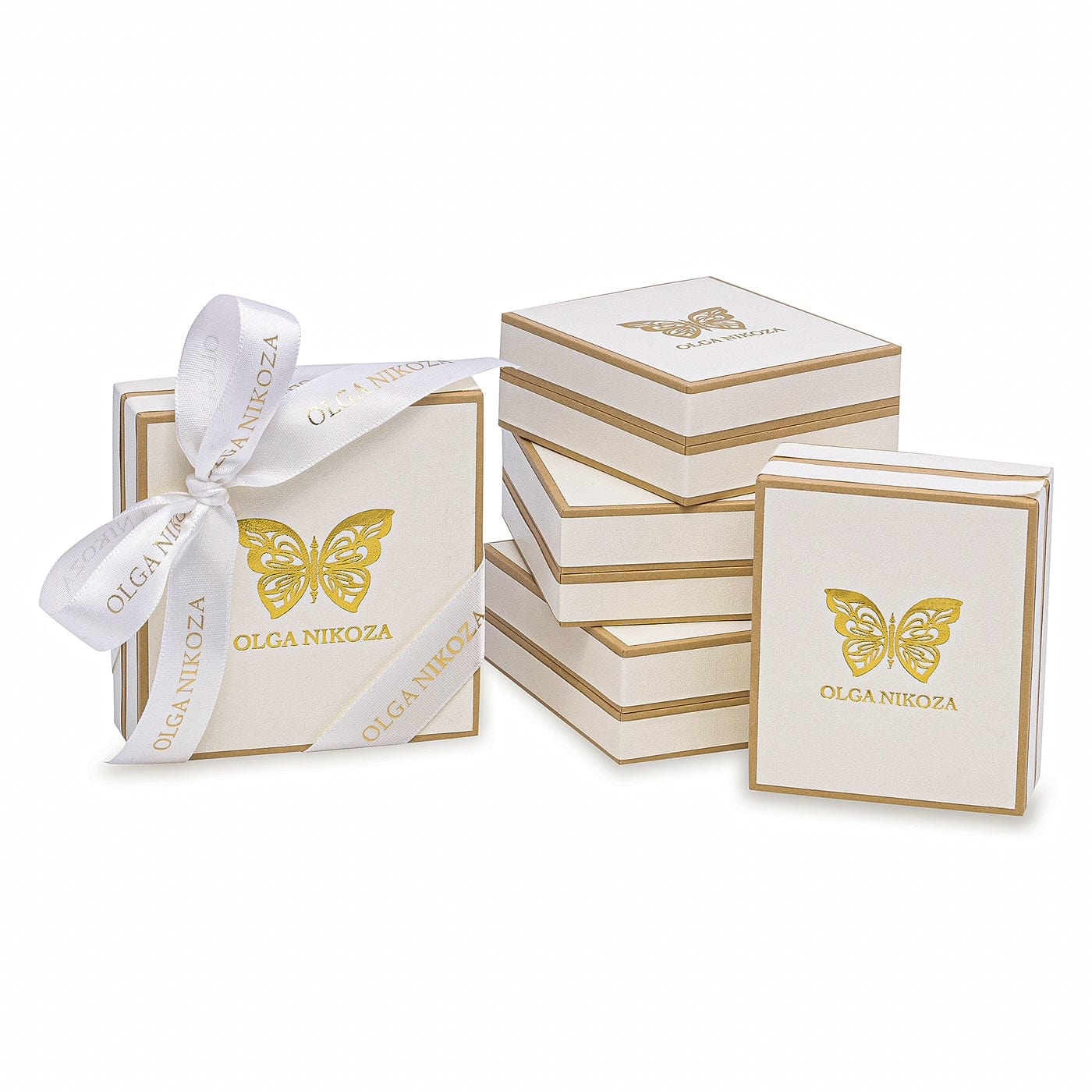Set of Olga Nikoza boxes with a butterfly design and white ribbon on a white background