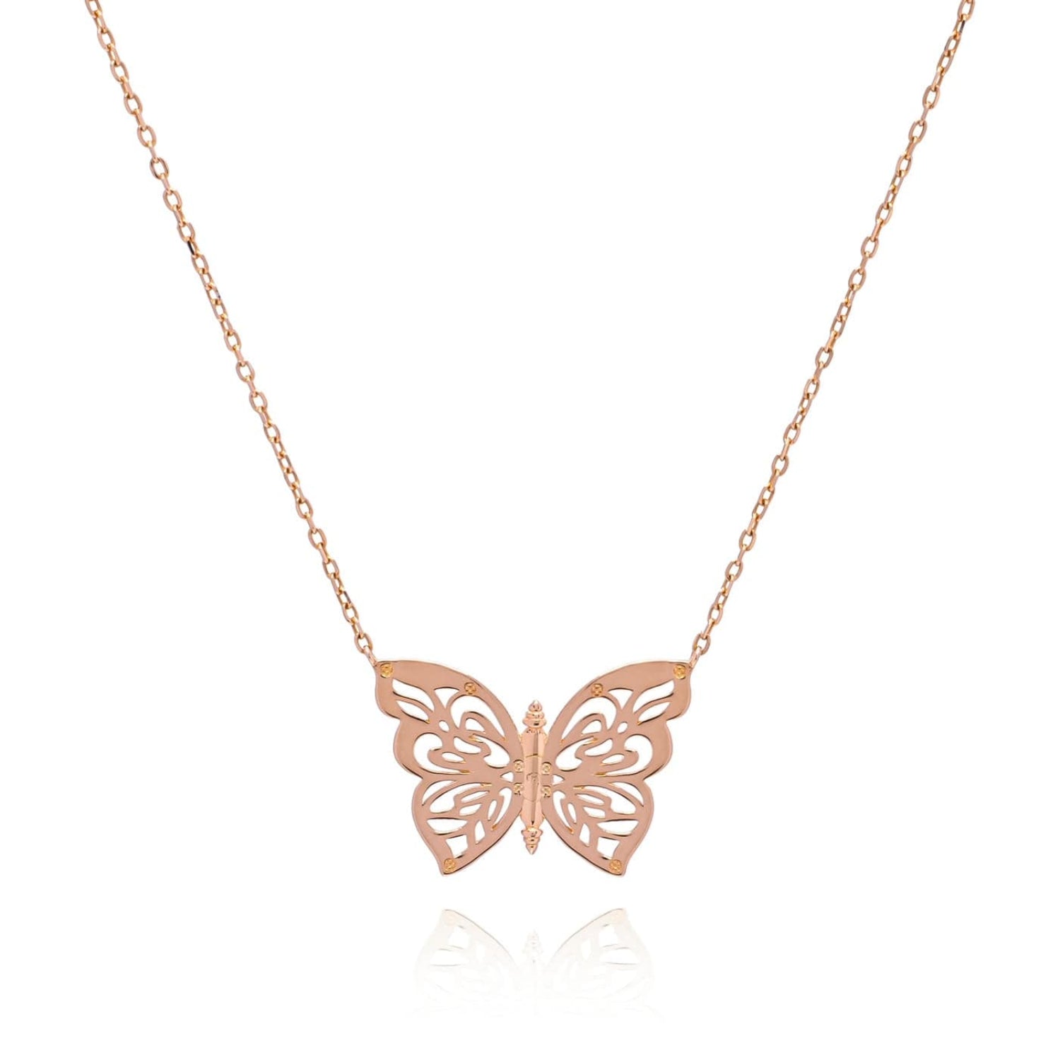Rose gold butterfly necklace on a white background