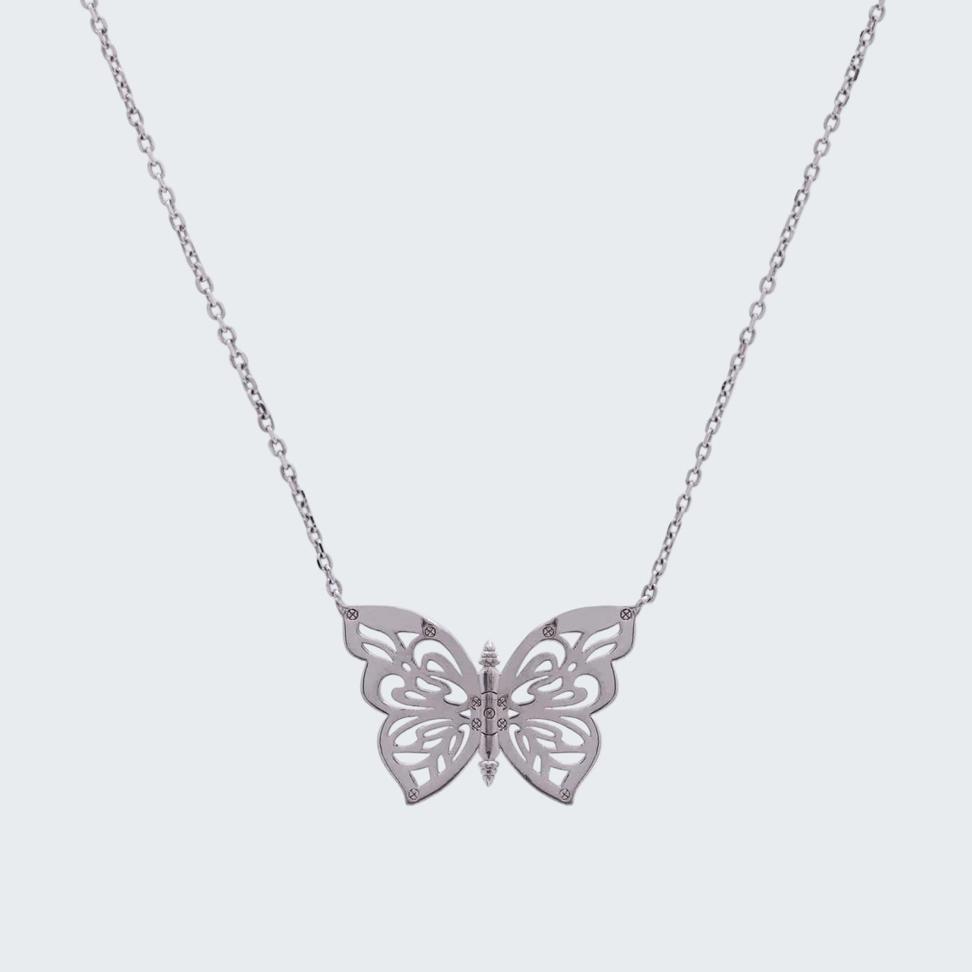 Silver butterfly necklace on a white background