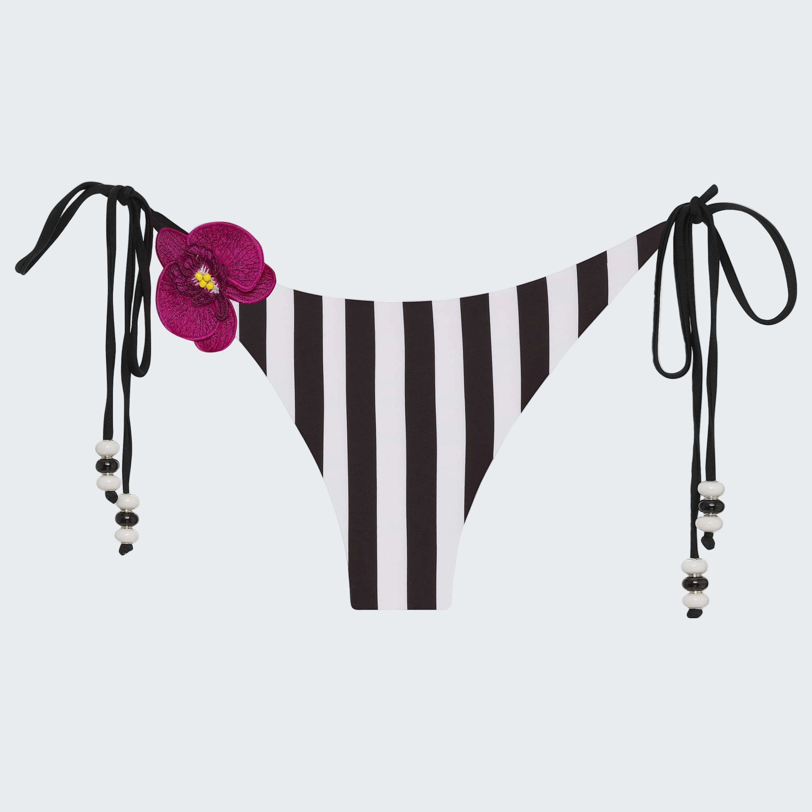 Purple bikini bottom with floral design and black straps on a white background