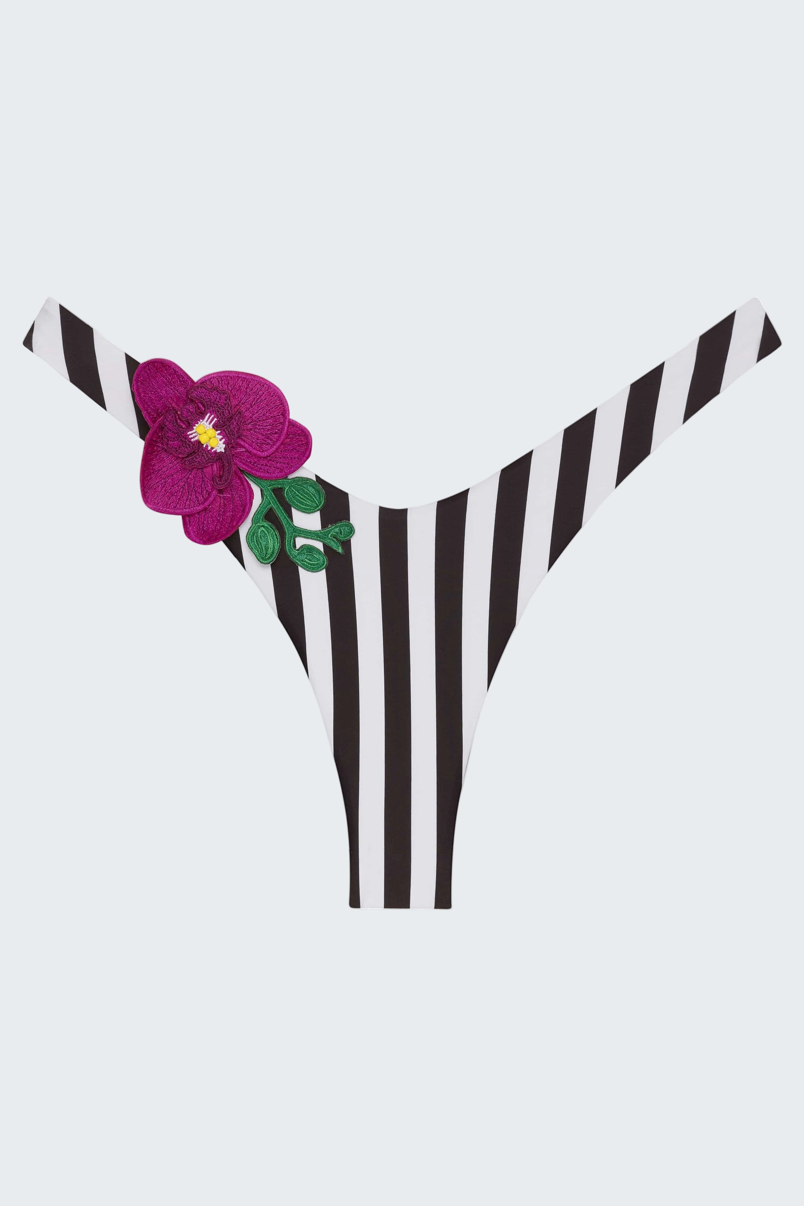 Black and white striped bikini bottom with a purple flower on a white background