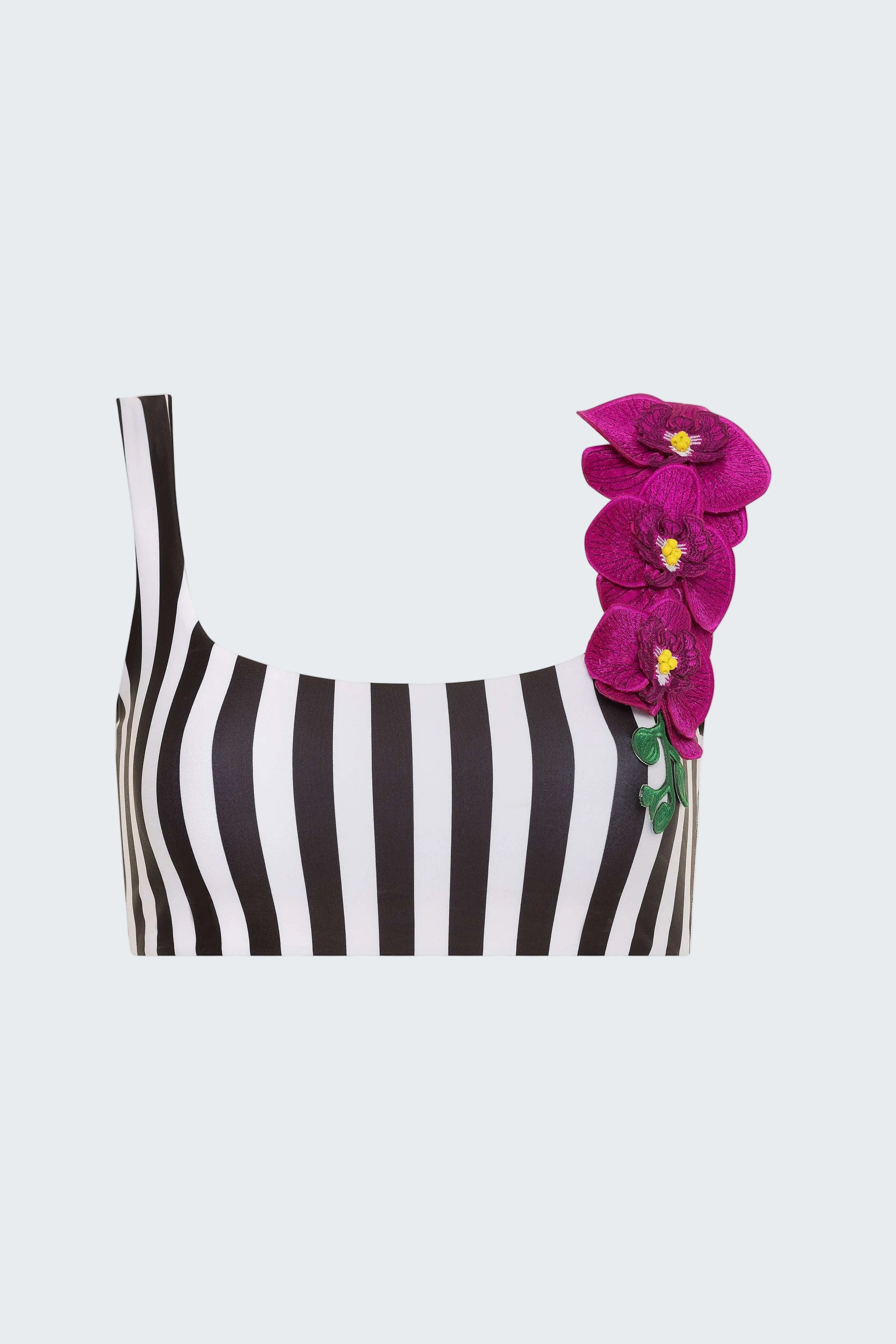 Black and white striped top with pink floral accessory on a white background