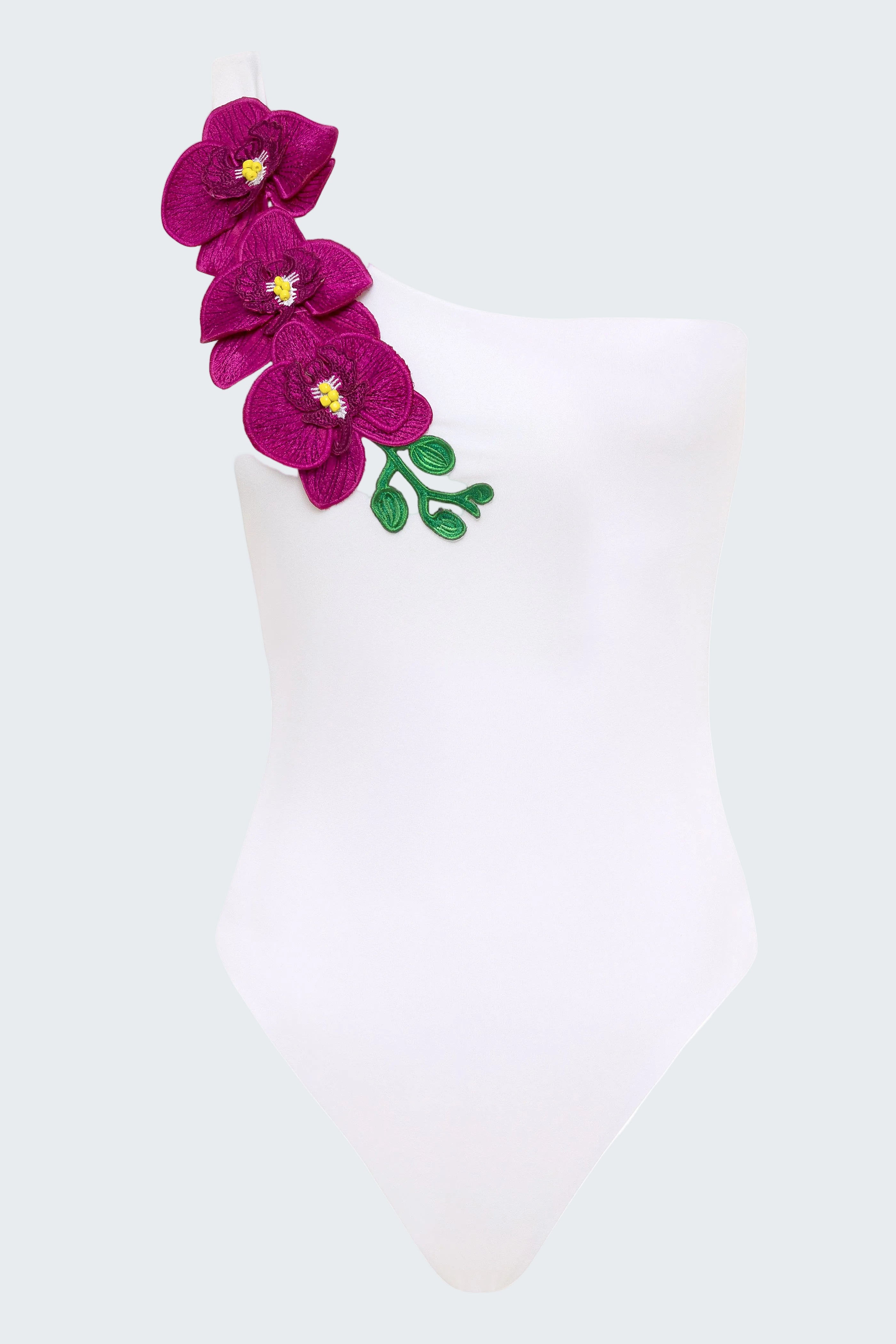 White swimsuit with purple floral design on a white background