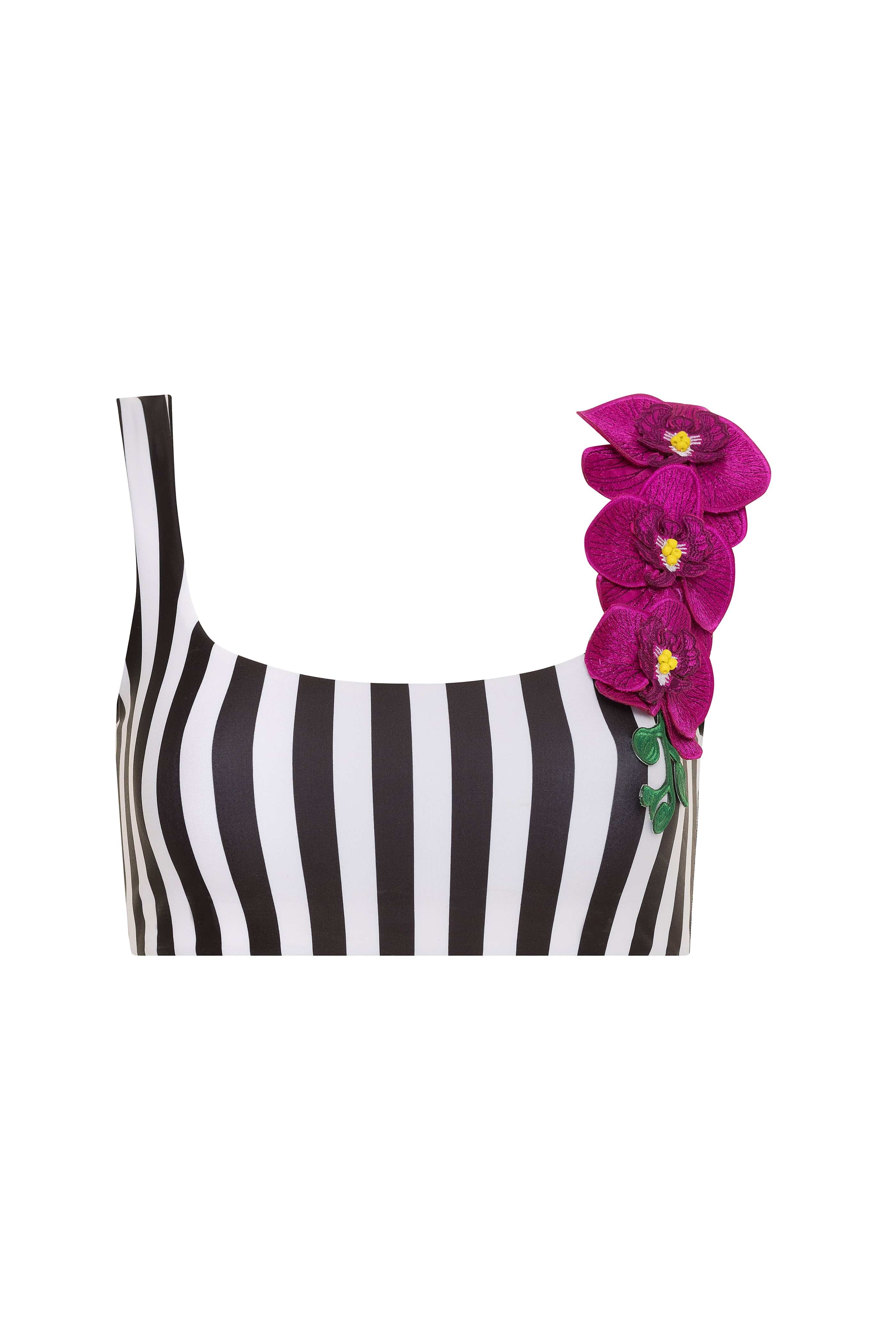Black and white striped top with pink floral accessory on a white background