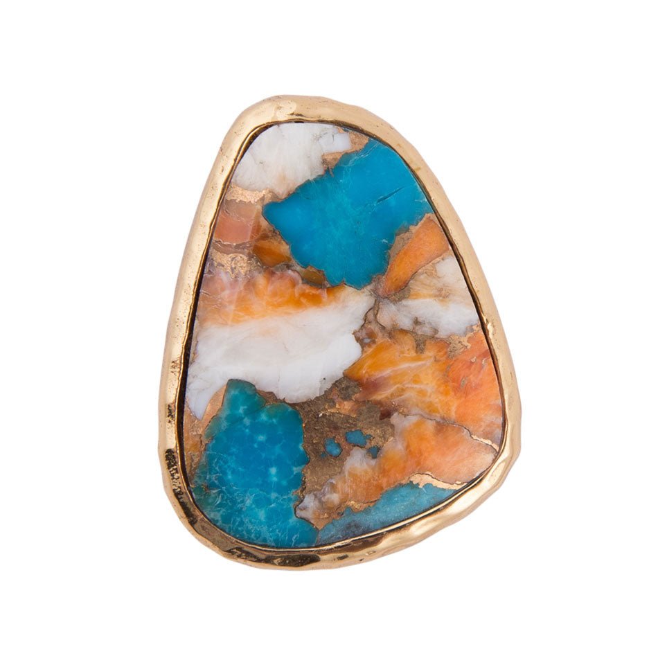 Gold ring with a colorful stone on a white background