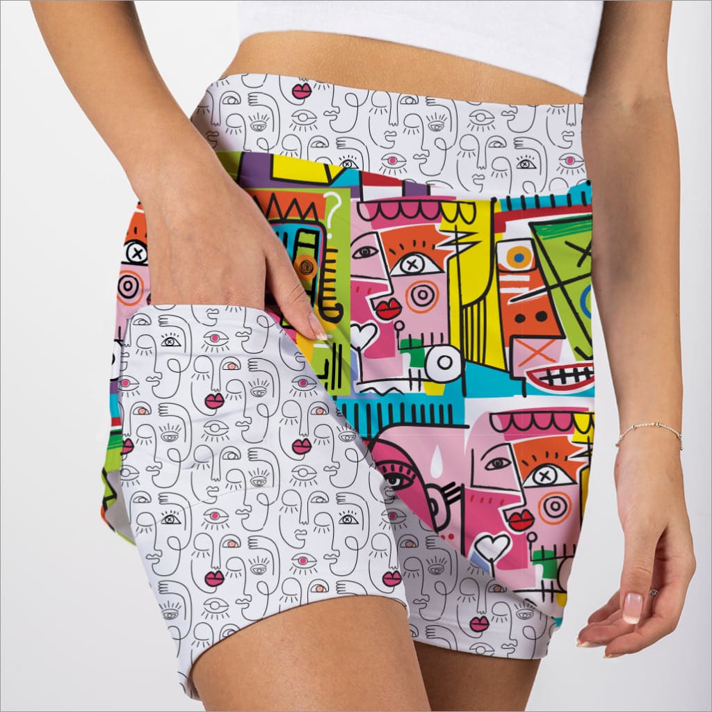 Colorful patterned shorts with abstract designs on a white background