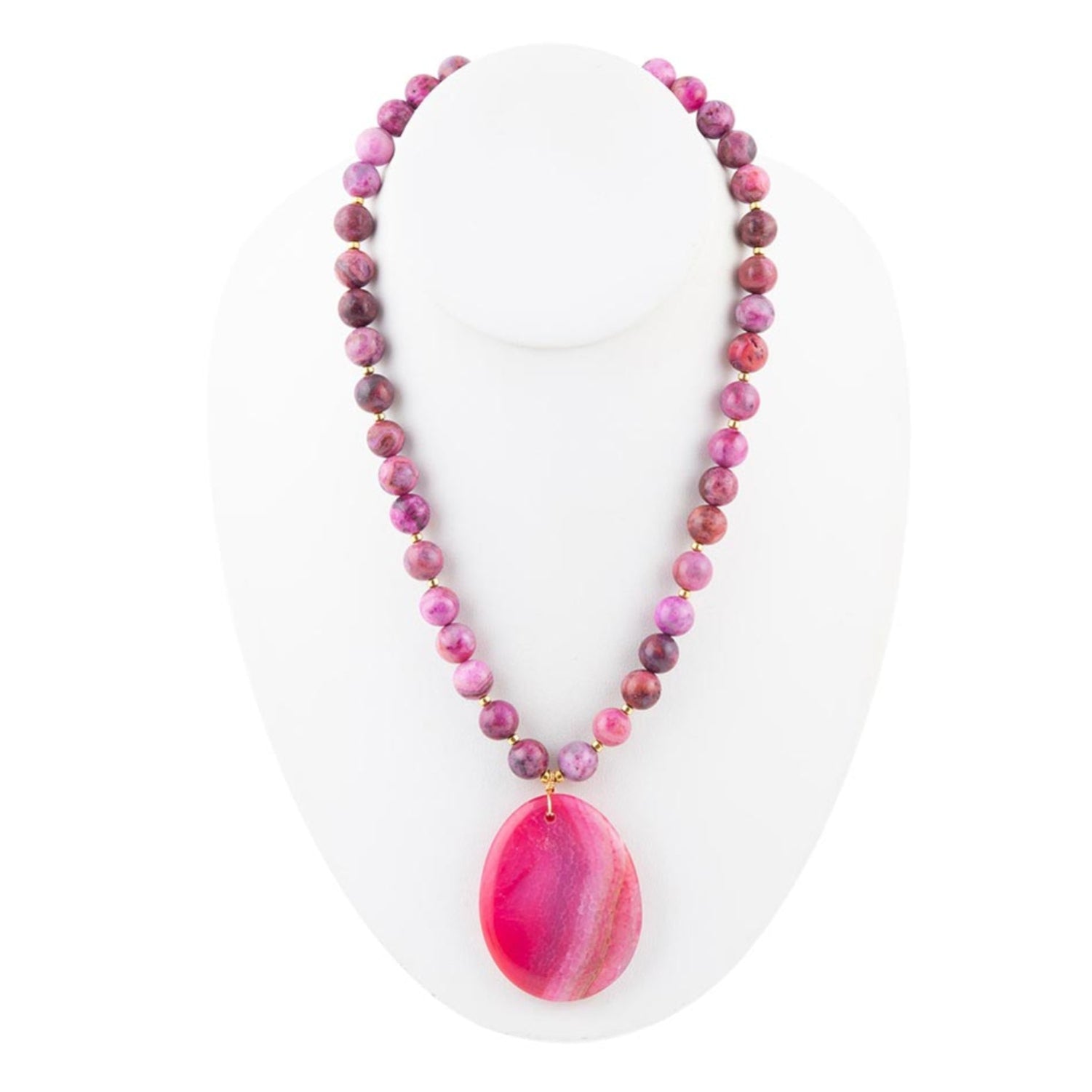Necklace with pink and purple beads and a large pink stone pendant on a white background