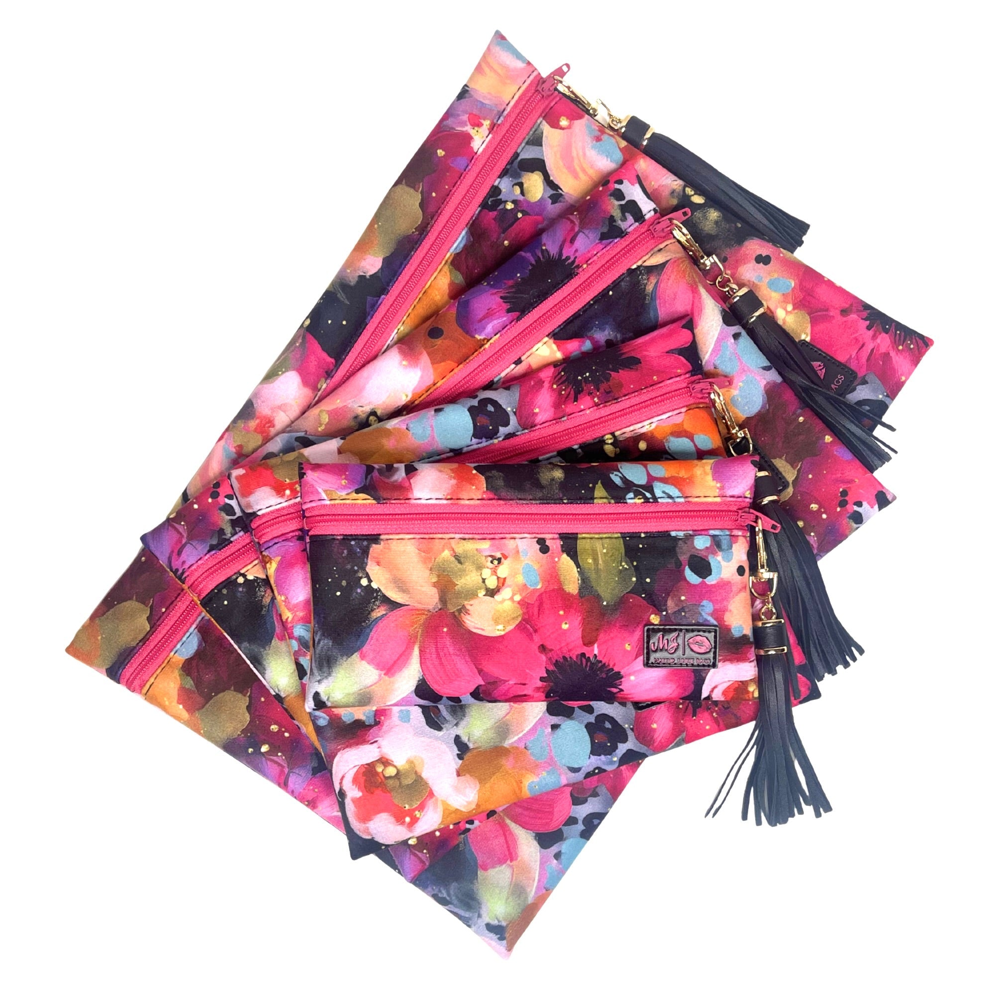 Set of floral patterned pouches with zippers and tassels on a white background