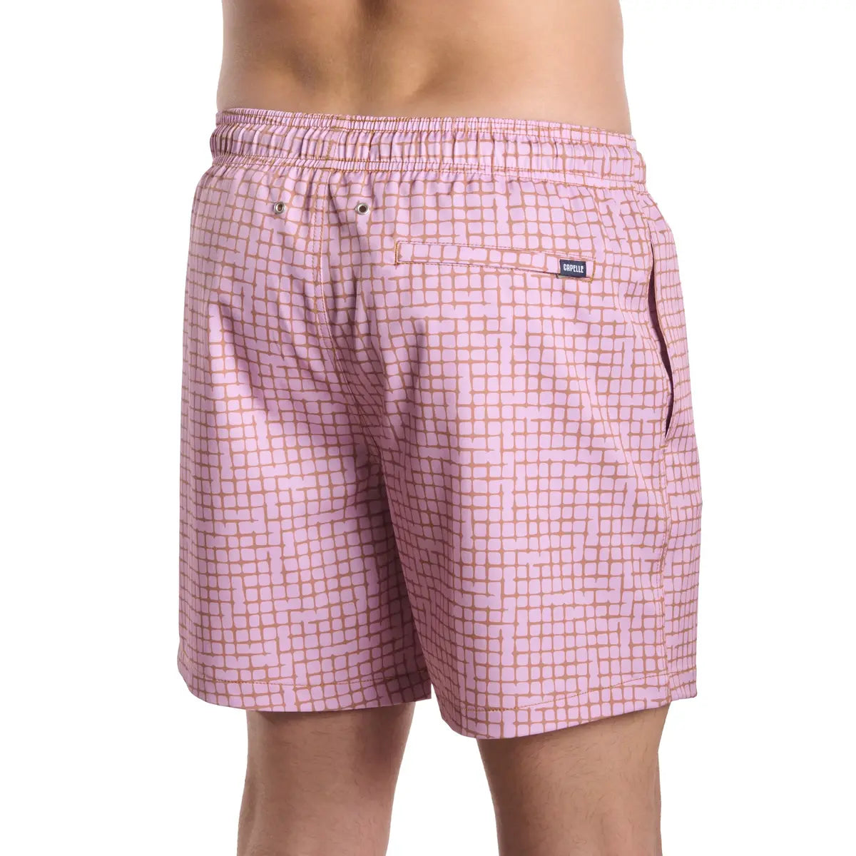 Pink checkered shorts worn by a person on a white background