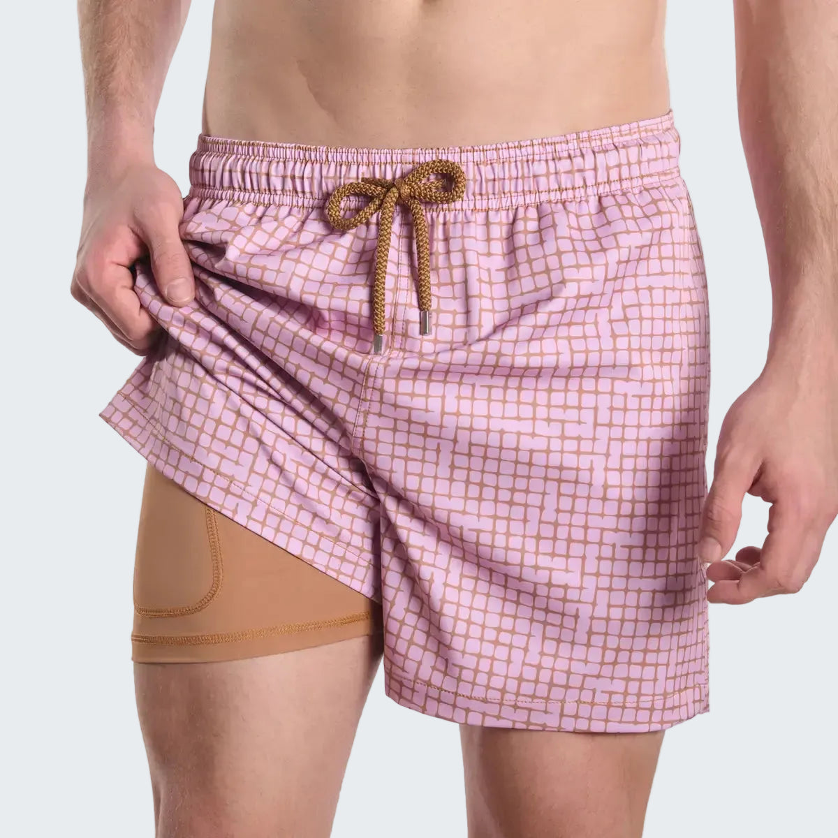 Pink checkered swim shorts with a brown drawstring on a white background