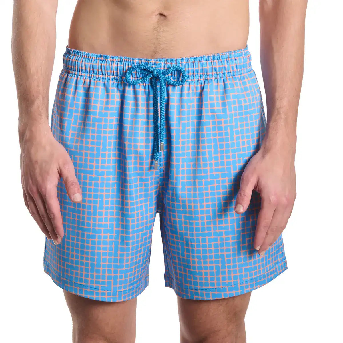 Blue checkered swim shorts worn by a person on a white background
