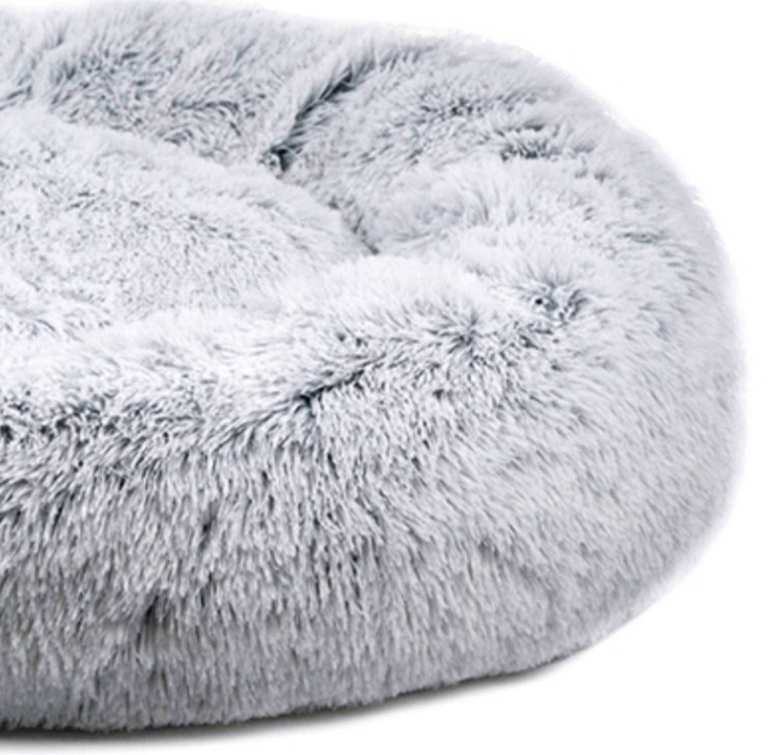 Close-up of a fluffy gray pet bed on a white background