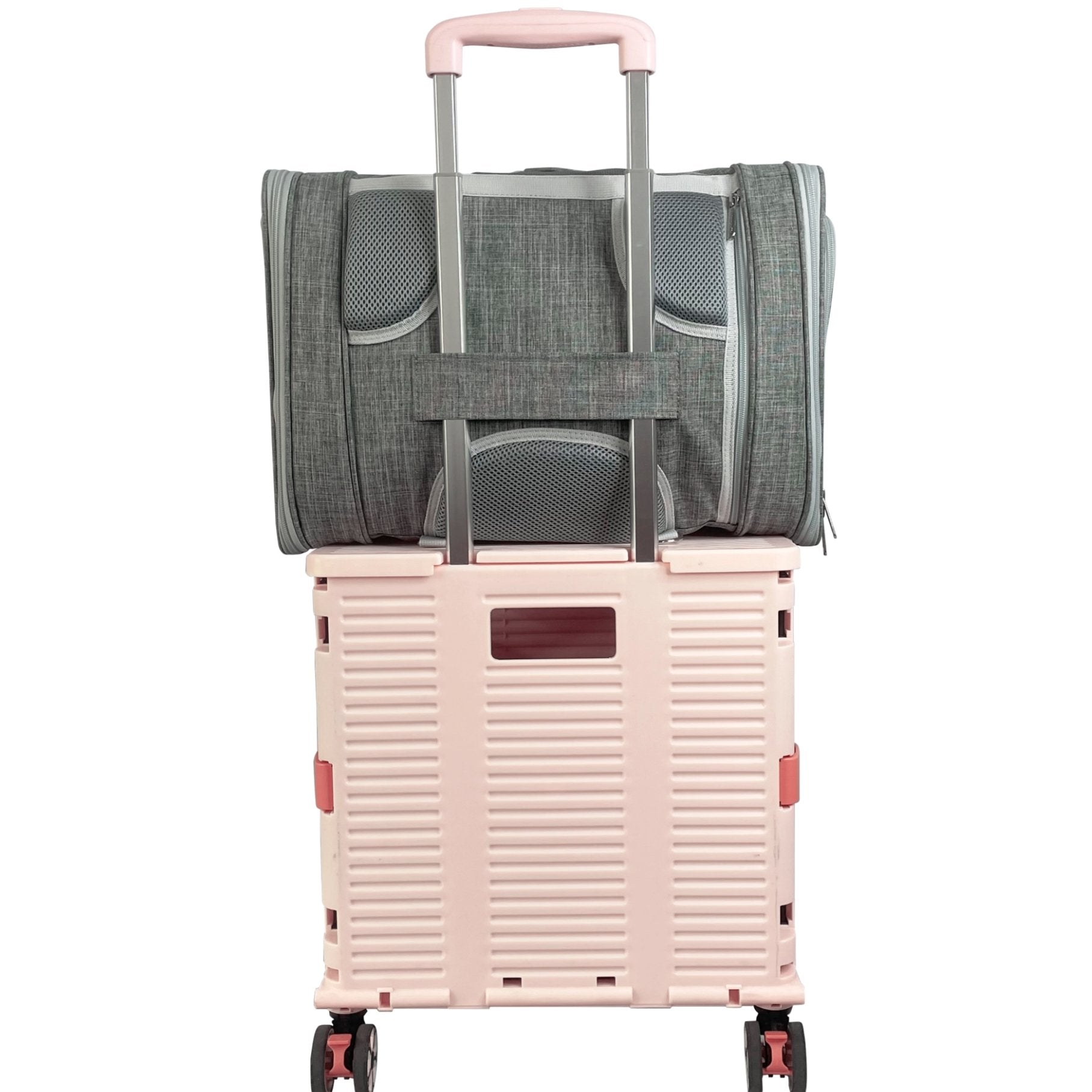 Pink suitcase with a gray bag on top on a white background