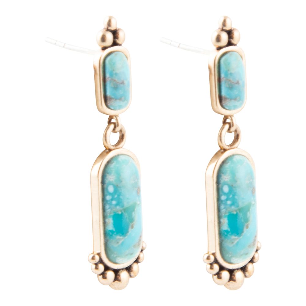 Turquoise stone earrings with gold accents on a white background