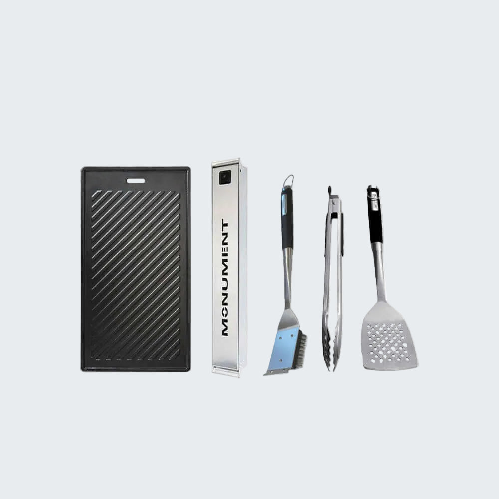 Grill tools and accessories with 'Monument' branding on a white background