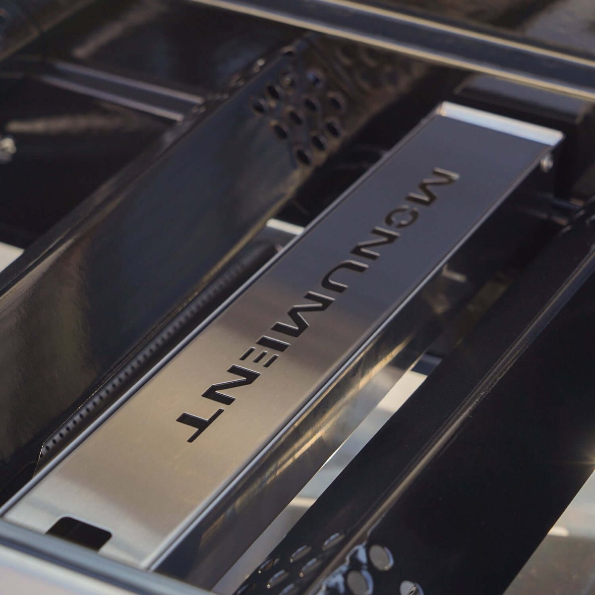 Close-up of a kitchen appliance with 'MONUMENT' branding.