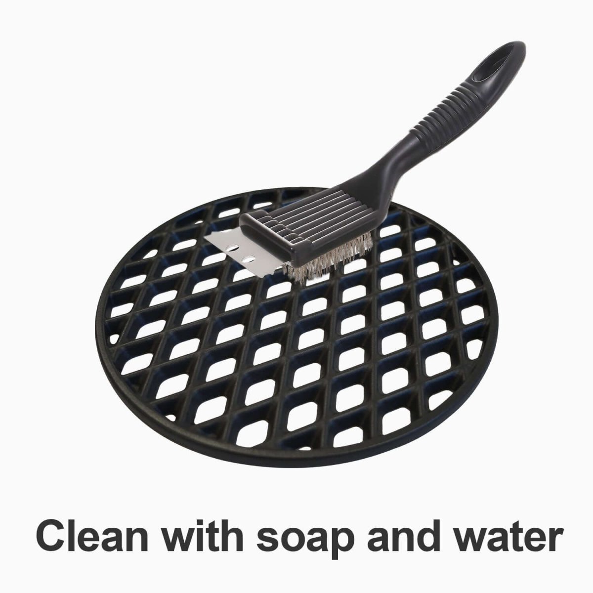 Black grill cleaning brush with a round grate on a white background