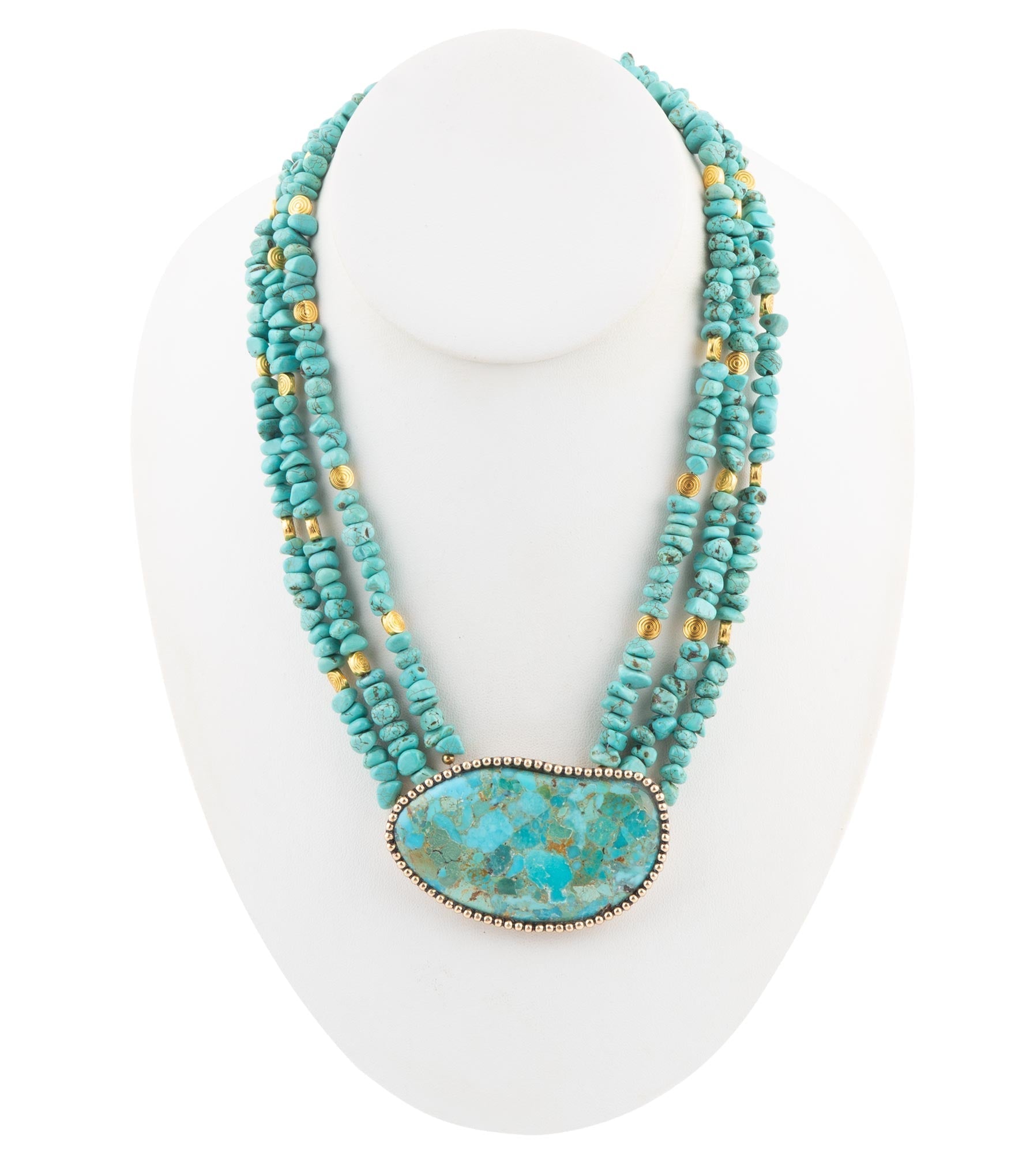 Turquoise beaded necklace with a large pendant on a white mannequin.