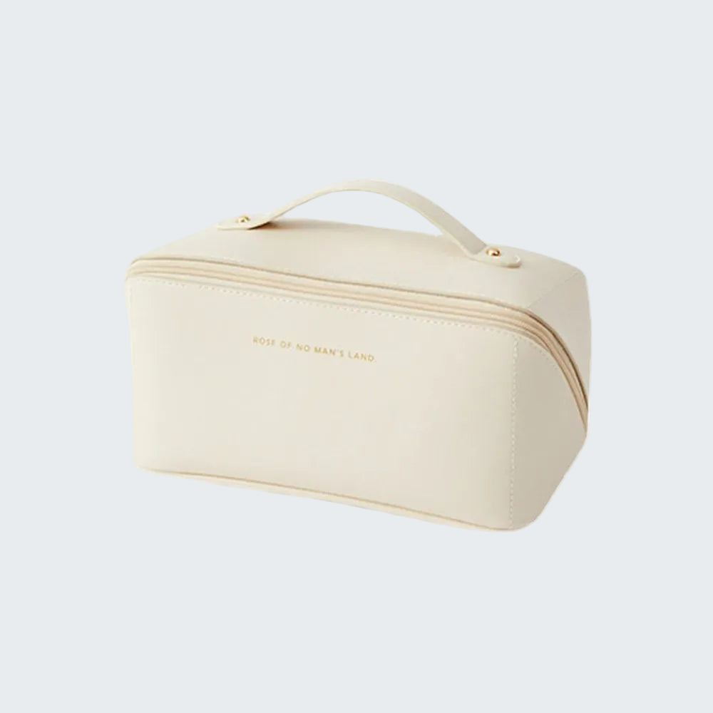 Beige cosmetic bag with 'Made of Many Things' branding on a white background