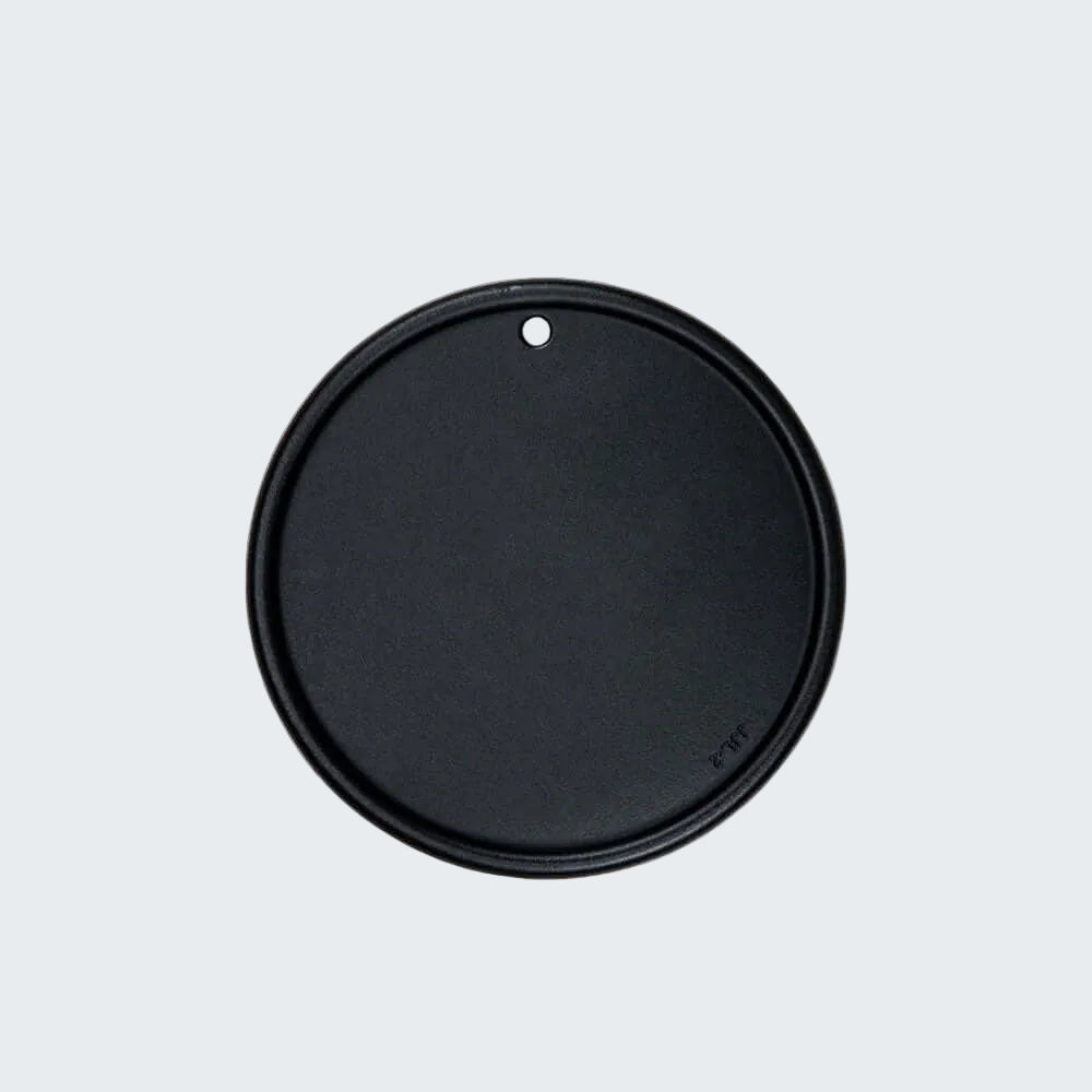 Black round lid on a white background