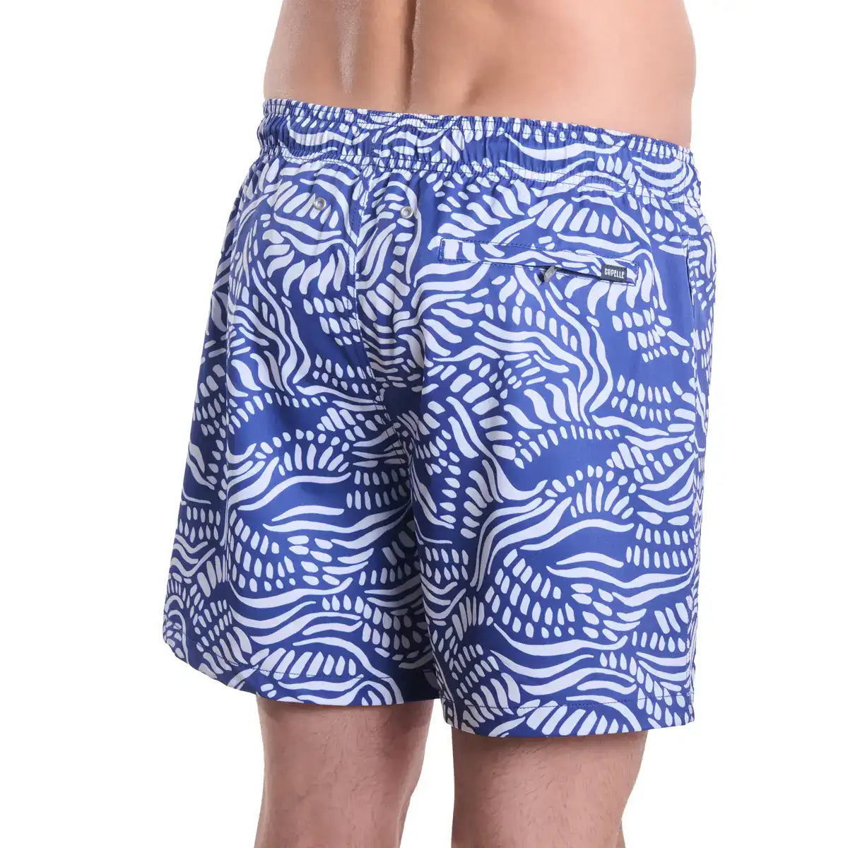 Blue and white patterned swim shorts on a white background